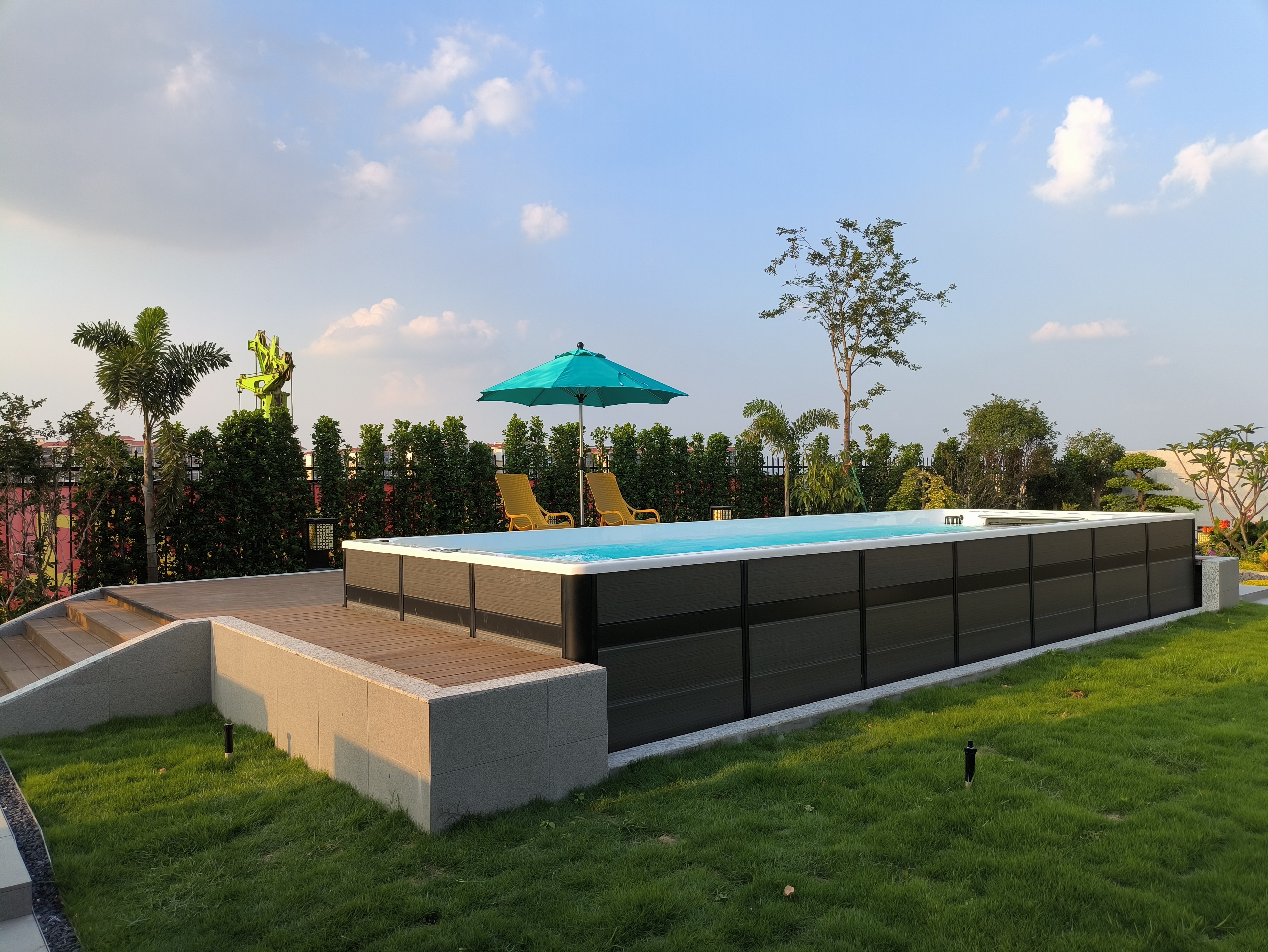 Outdoor swim spa installed in a residential backyard setting