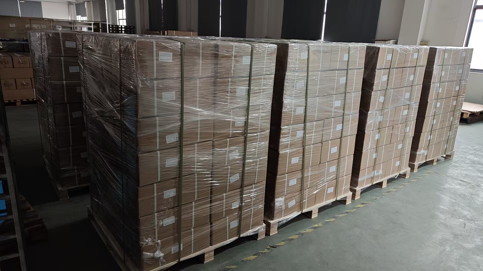 Palletized DC motor shipment ready for export delivery