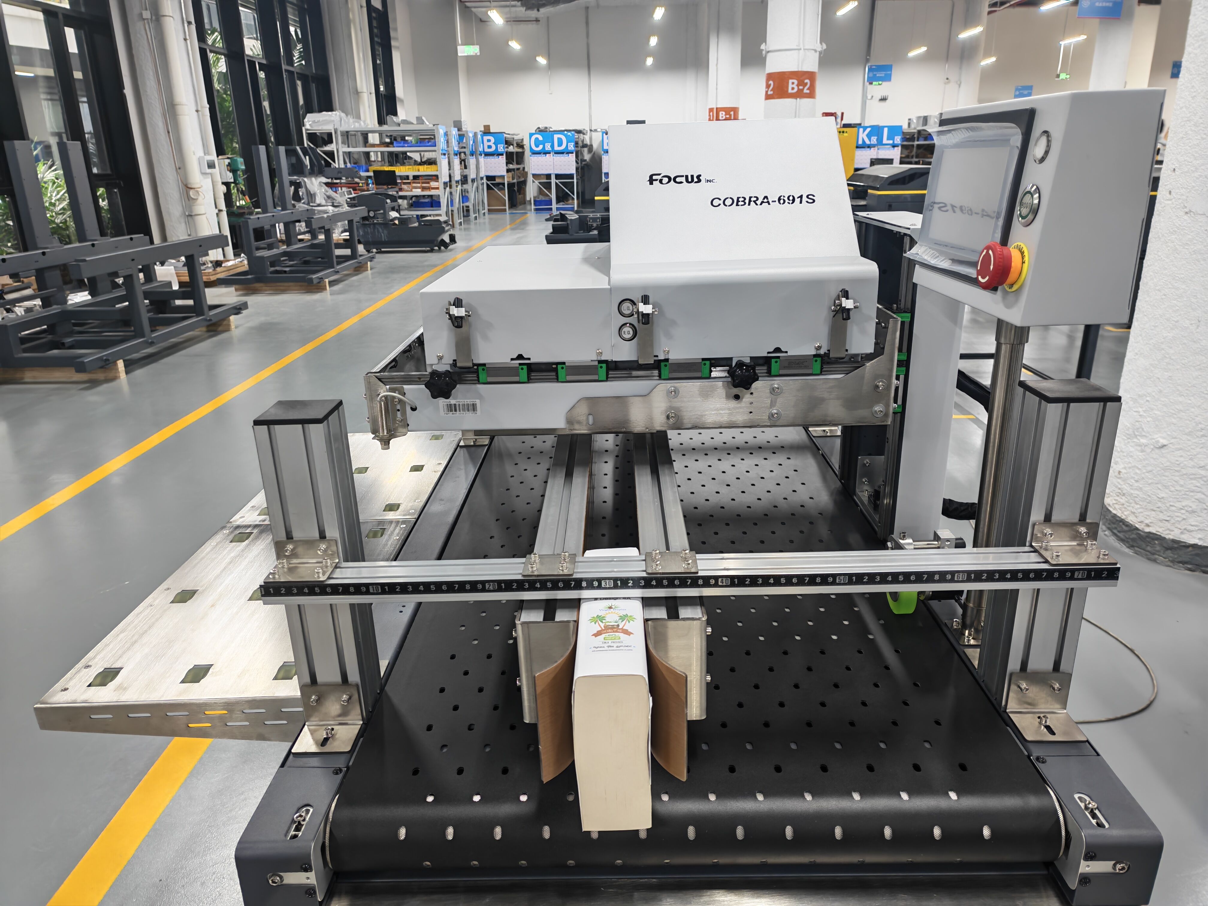 Customized book edge printing jig installed on a FocusInc single pass printer for book and notebook spines