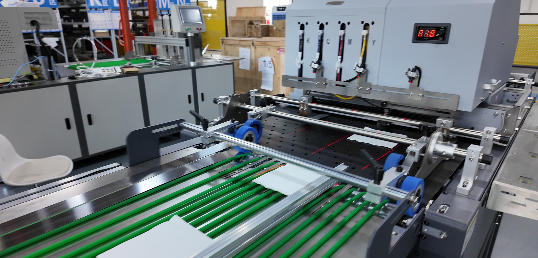 Single pass printer transport section handling flexible sheet material and rigid media before the print station