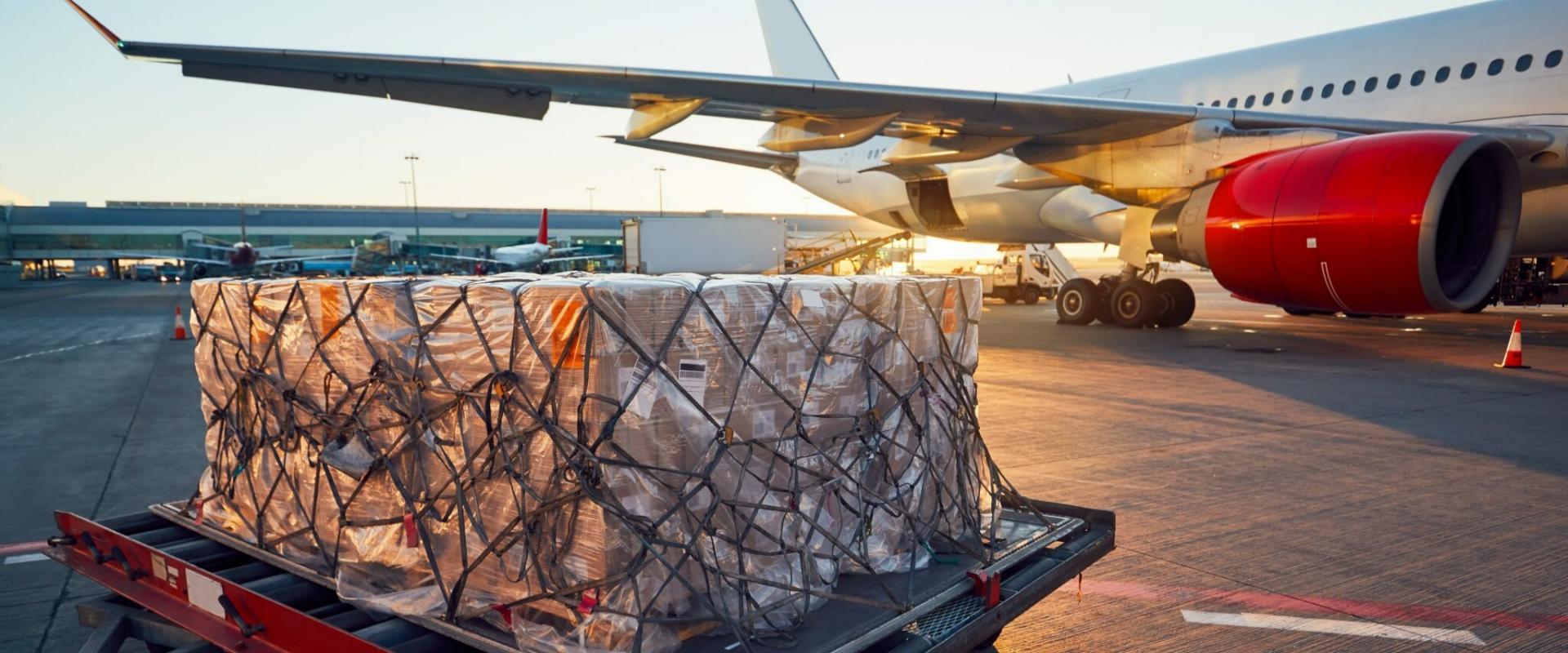 Palletized air cargo staged at an airport terminal for China to India airport-to-airport air freight