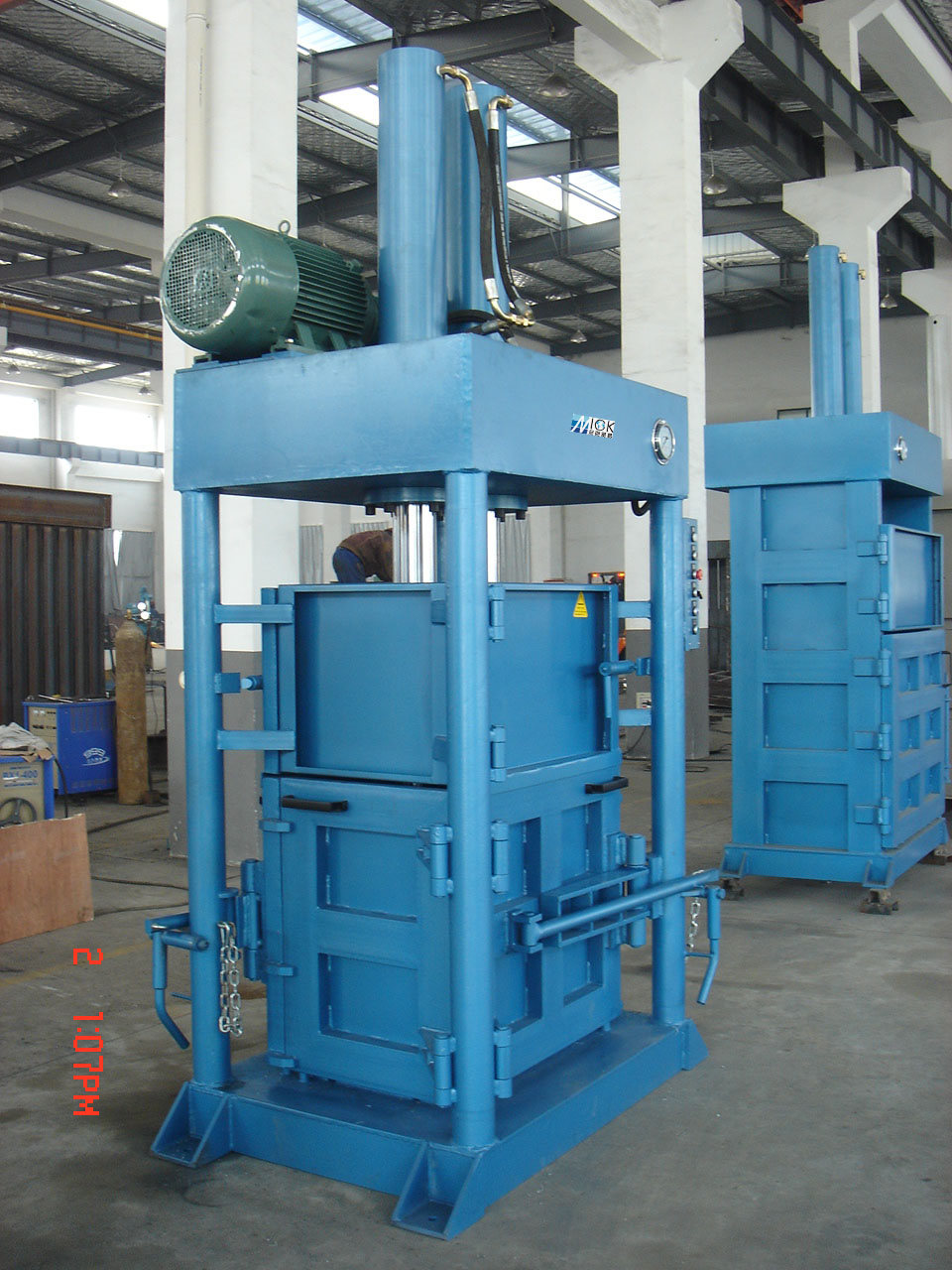 NK110T150 baler in operation with bales