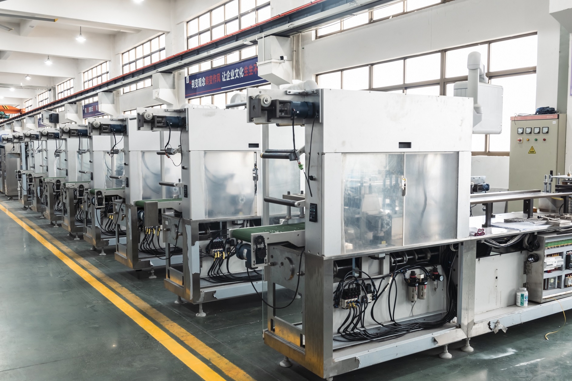 Blister machine workshop at Hoping Machinery showing precision assembly area