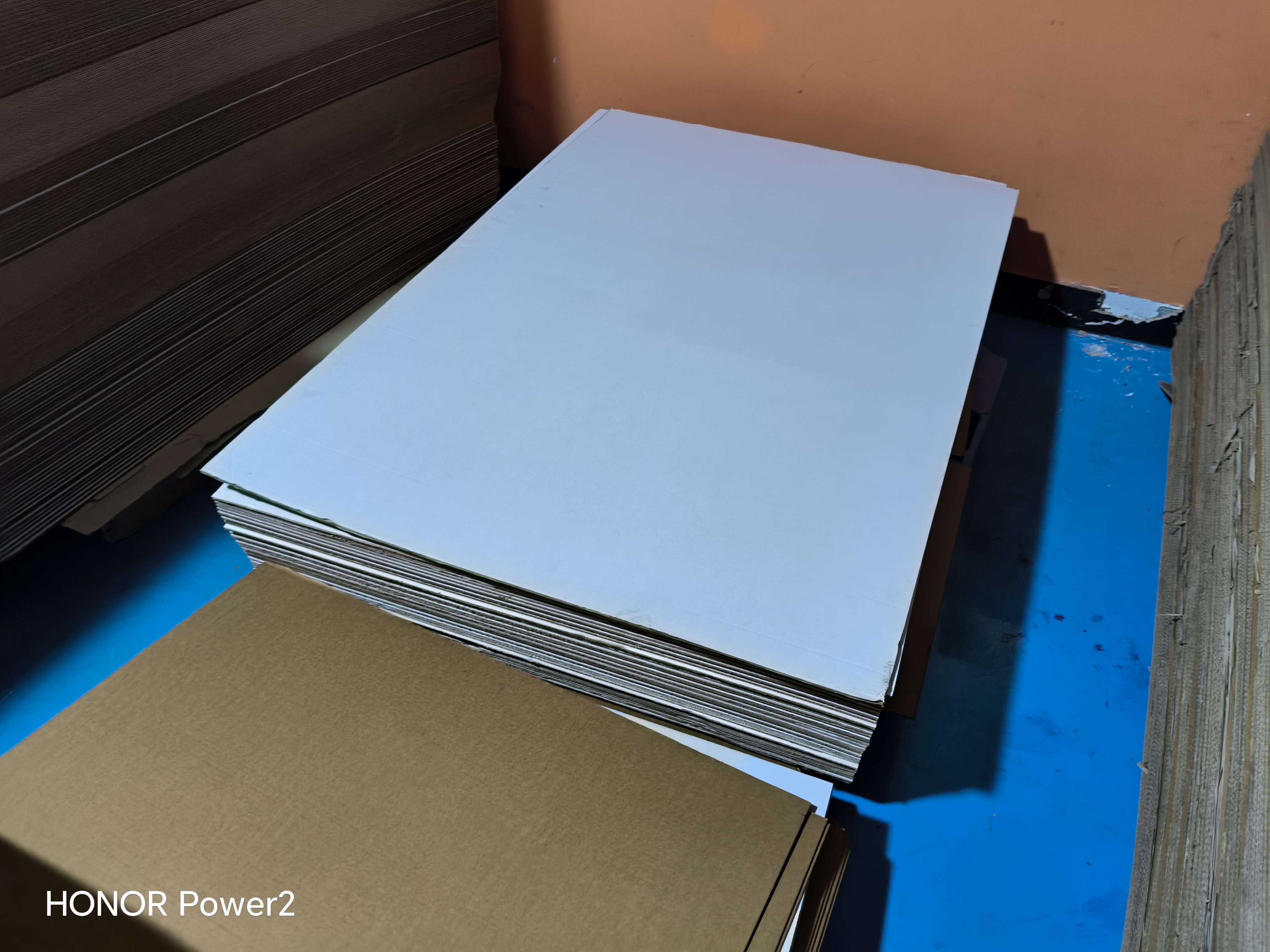 White coated paperboard sheet used as a printing substrate on an industrial digital press