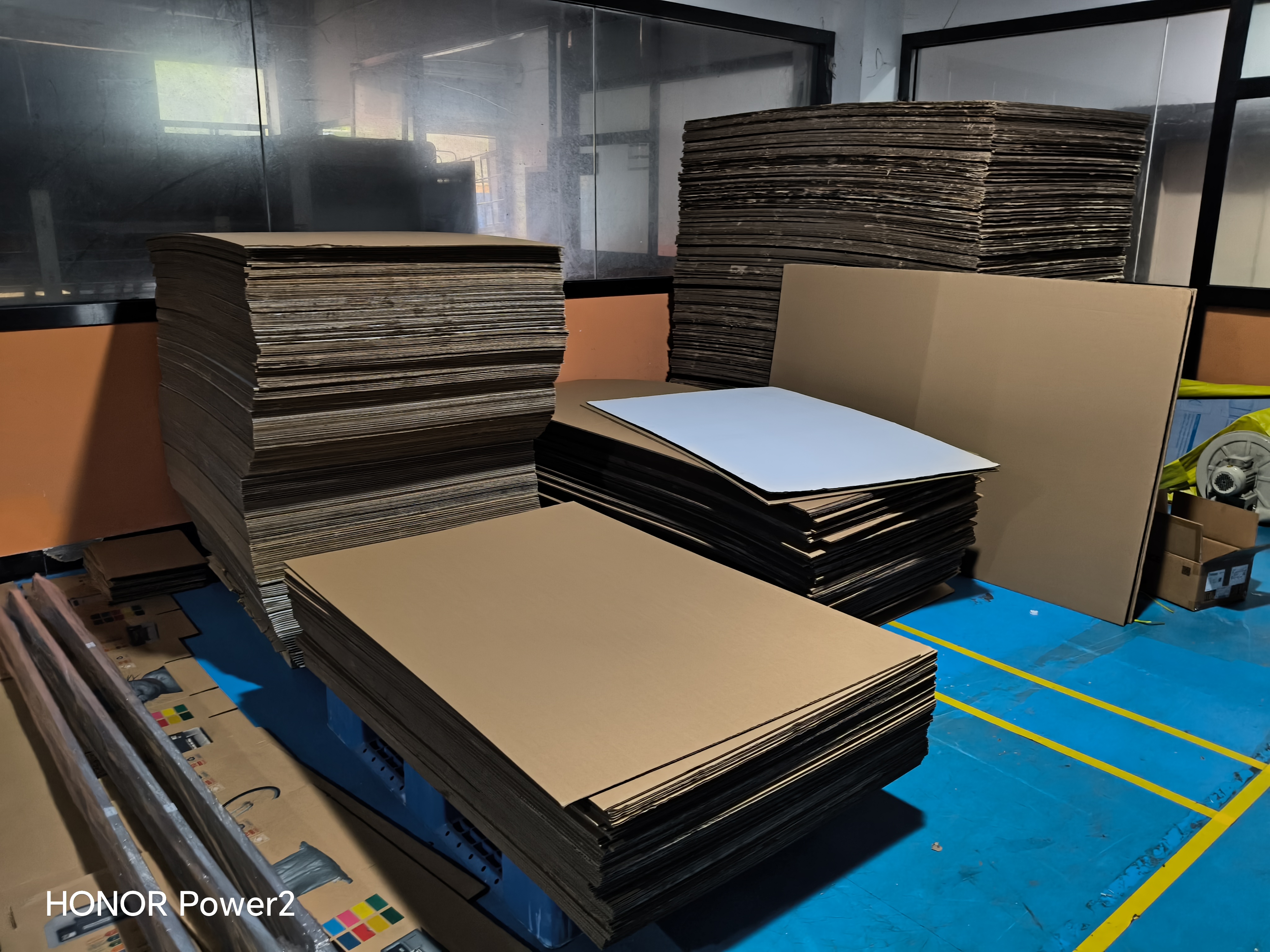 Bulk corrugated paper stock staged for digital printing production