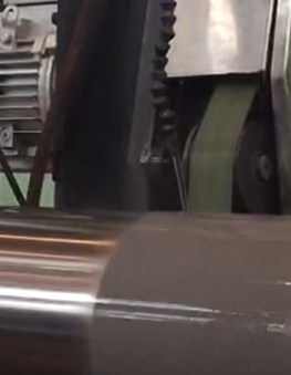 Resin diamond belt grinding in operation
