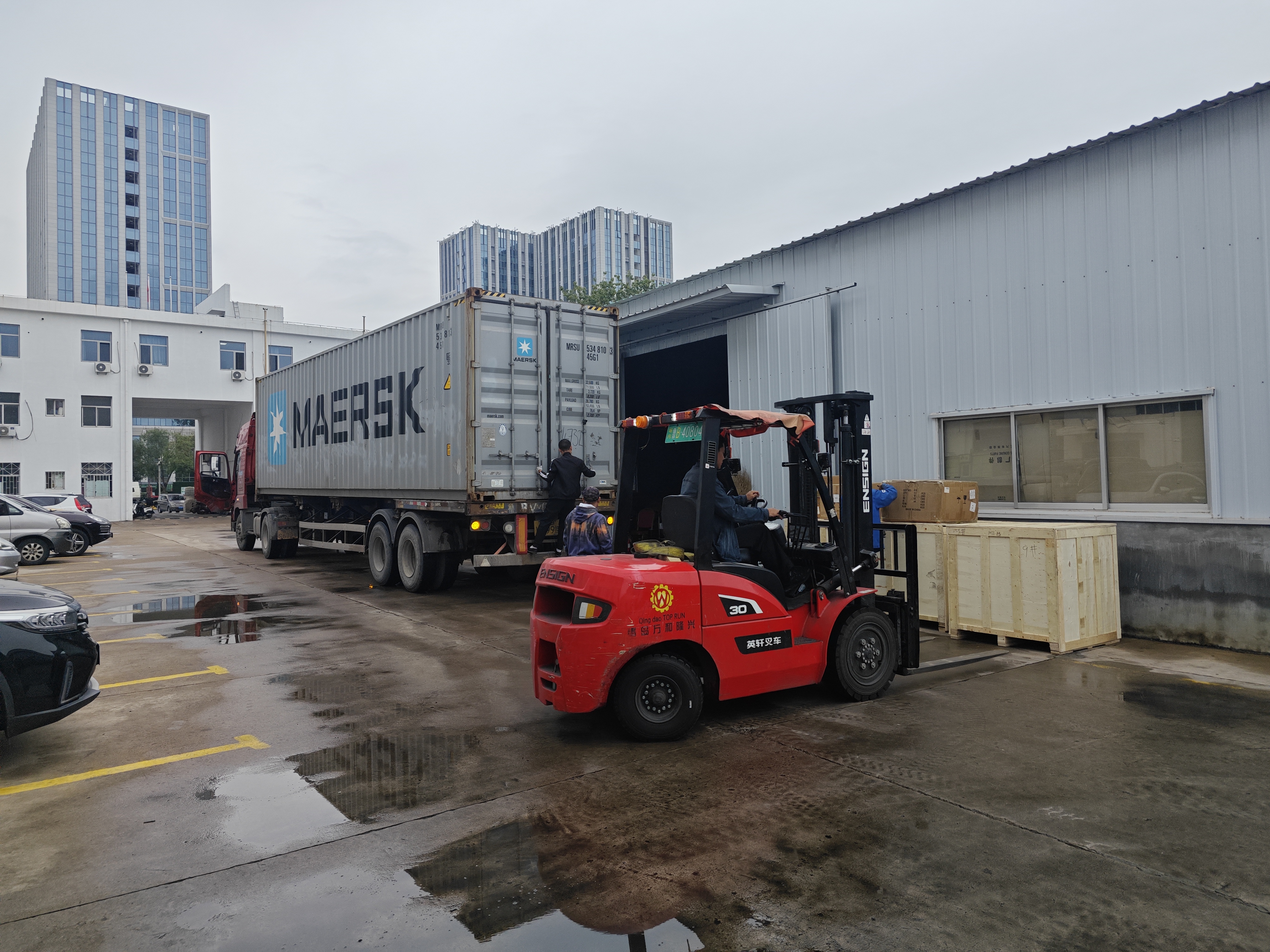 Truck crane spare parts shipment prepared for export under standard loading and tracking procedures