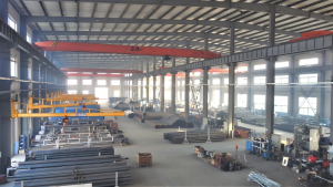 Large steel structure workshop with complete machining equipment, mass production base for agricultural irrigation equipment.
