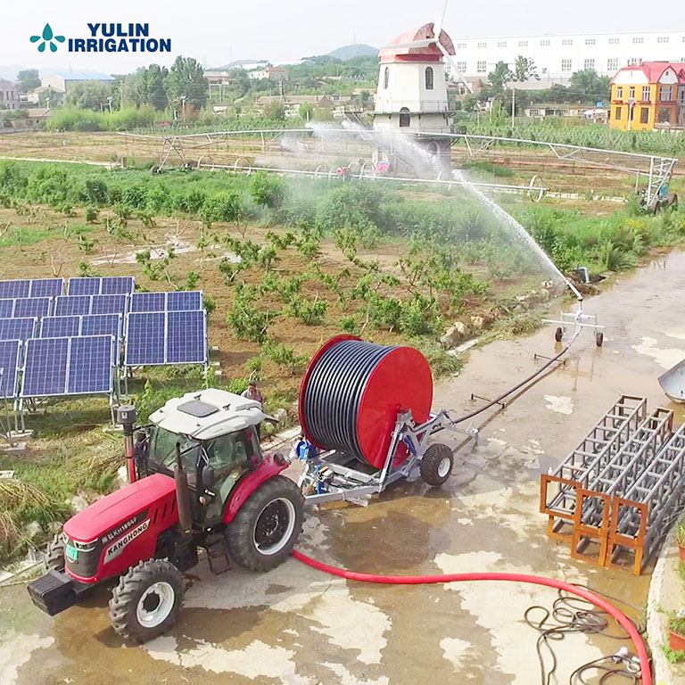 Hose reel irrigation machine irrigating soybeans on a large farm in Brazil