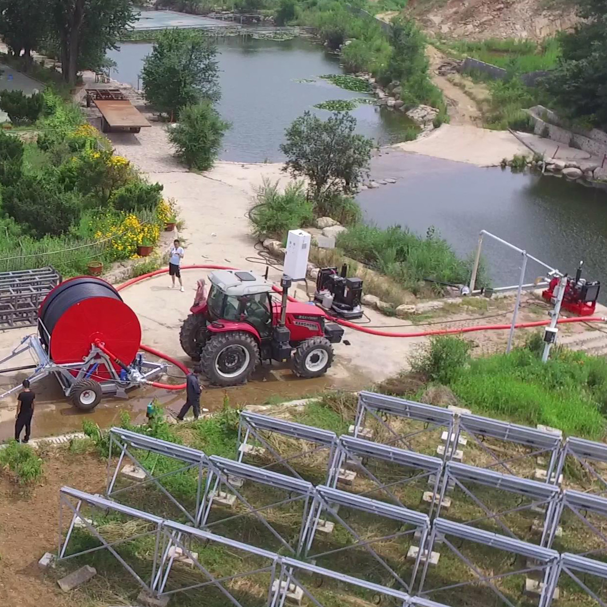 Hose reel irrigation machine irrigating soybean on a large farm block