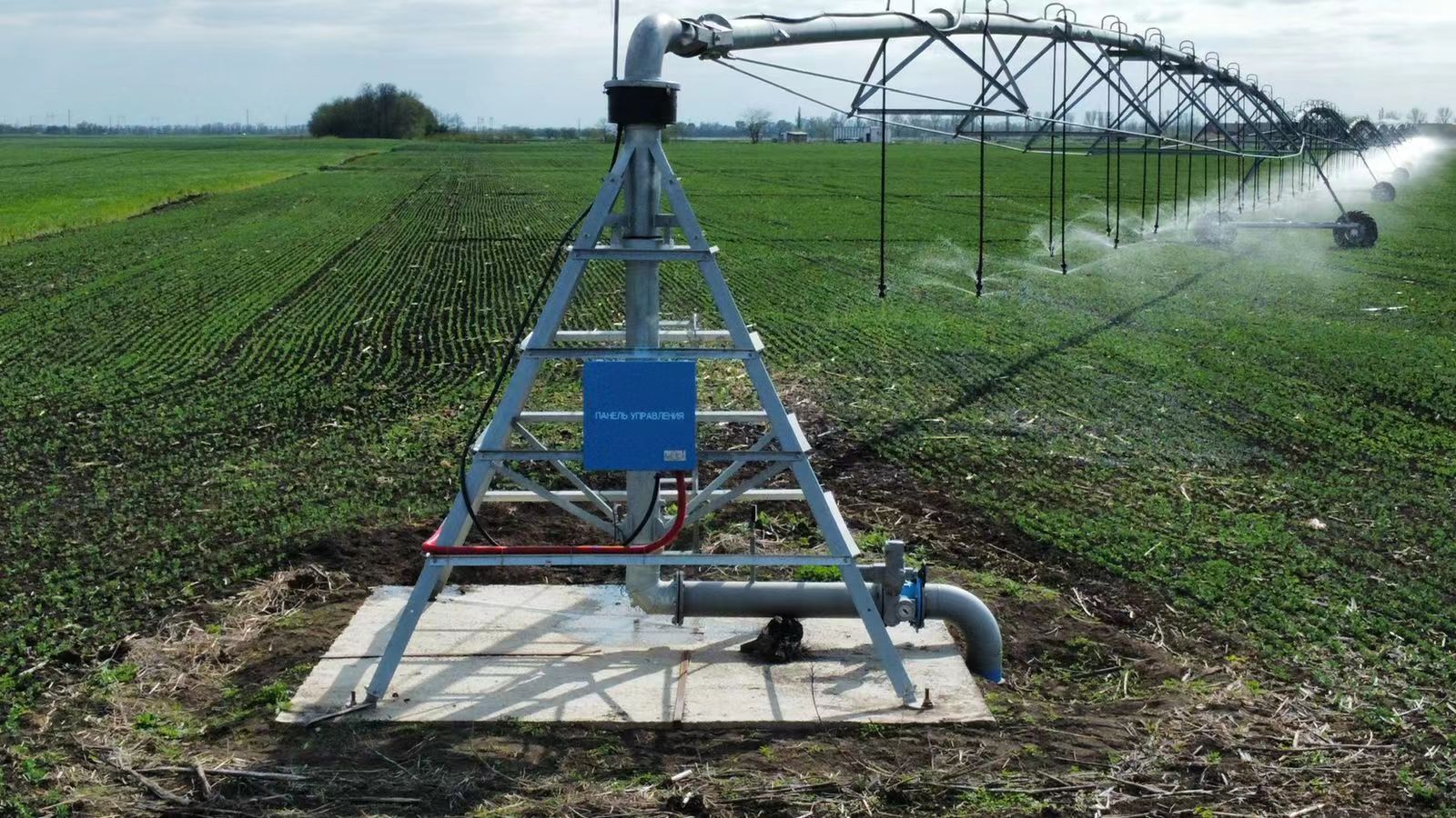 Center pivot irrigation system working in farmland