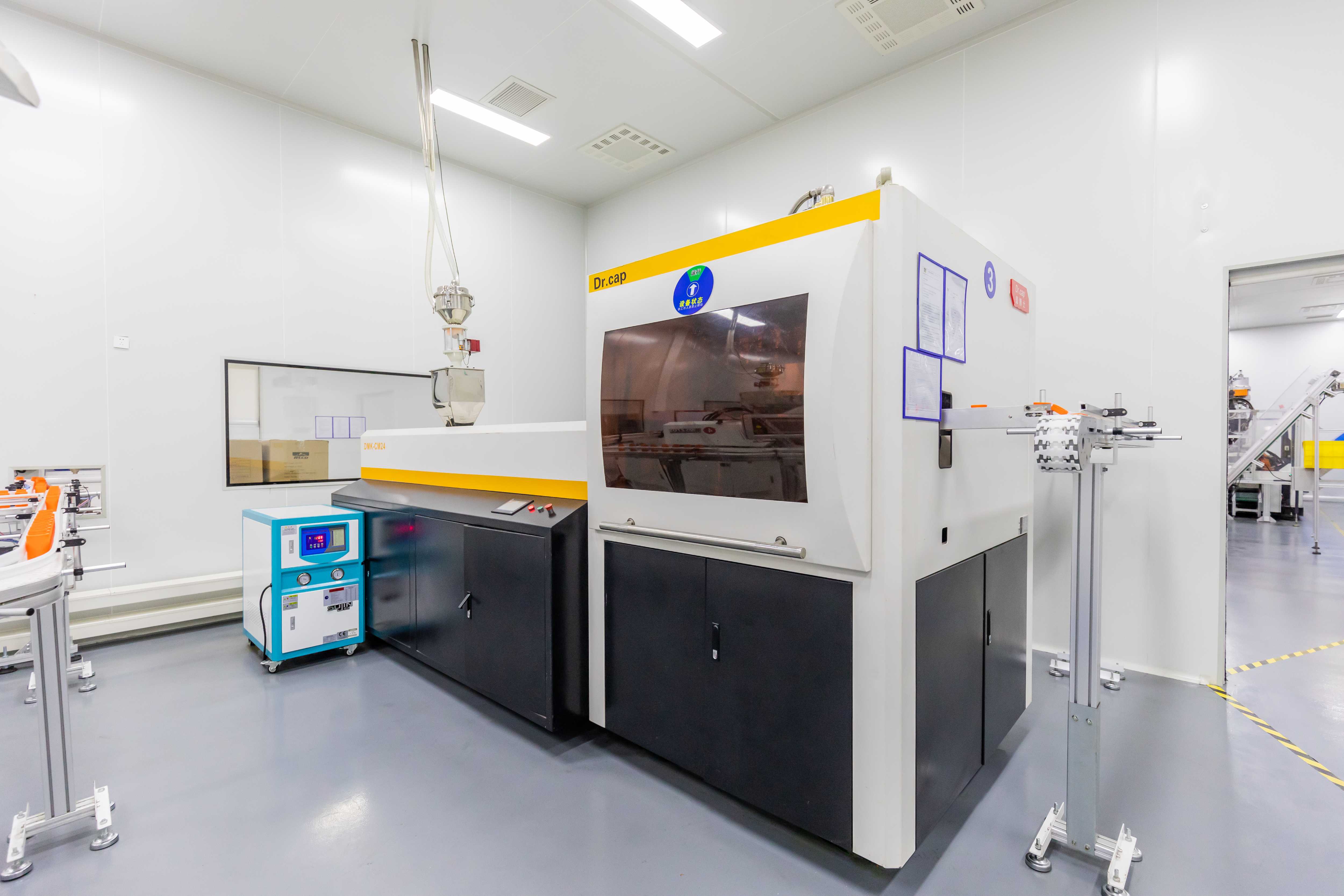Injection molding machine producing custom supplement packaging bottles