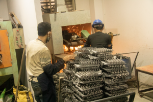 Bake in a high-temperature furnace; grind off casting marks, burrs, and parting lines using a grinding wheel to refine the surface.