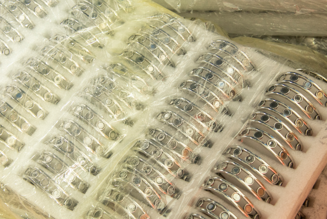 Quality control department inspection of stainless steel jewelry before batch release