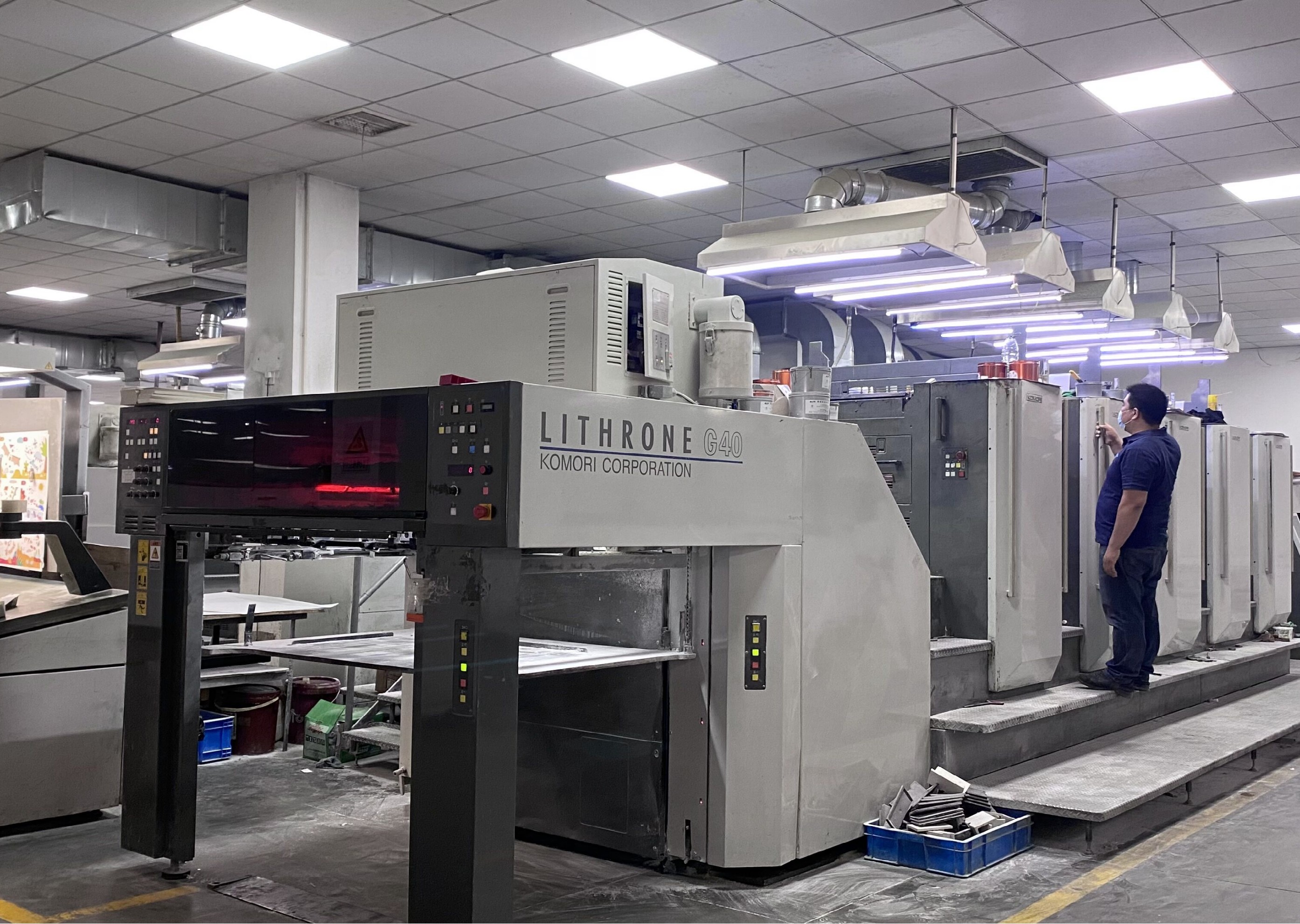 Production equipment used for custom card game printing, die-cutting, and quality control at Yawanhong