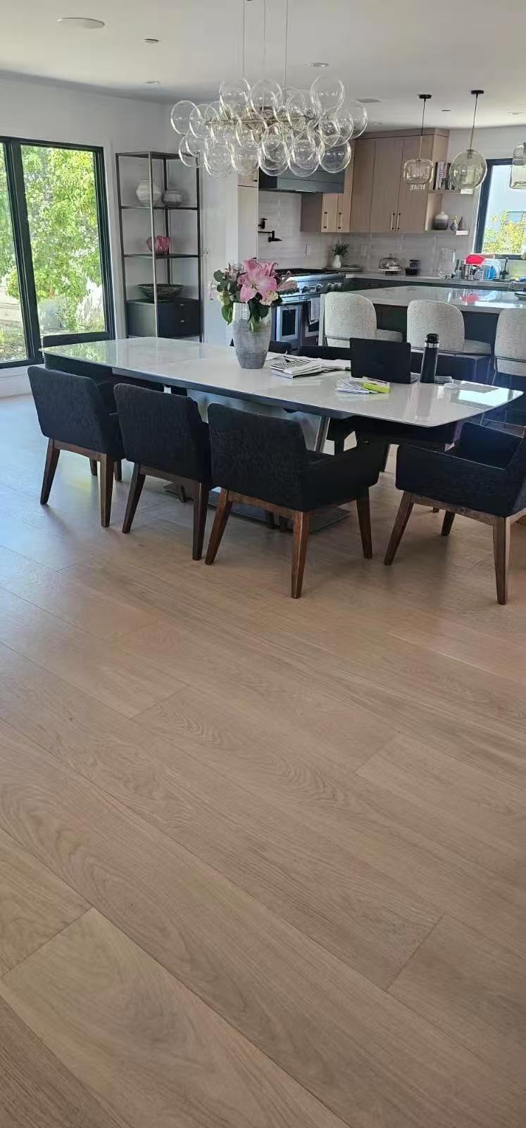Engineered hardwood flooring installed in a US residential project, wide plank herringbone pattern