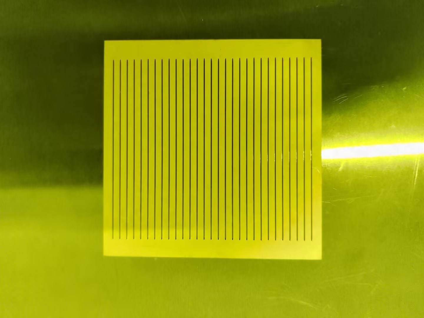 Ultrasonic spray coating of photoresist onto a semiconductor substrate