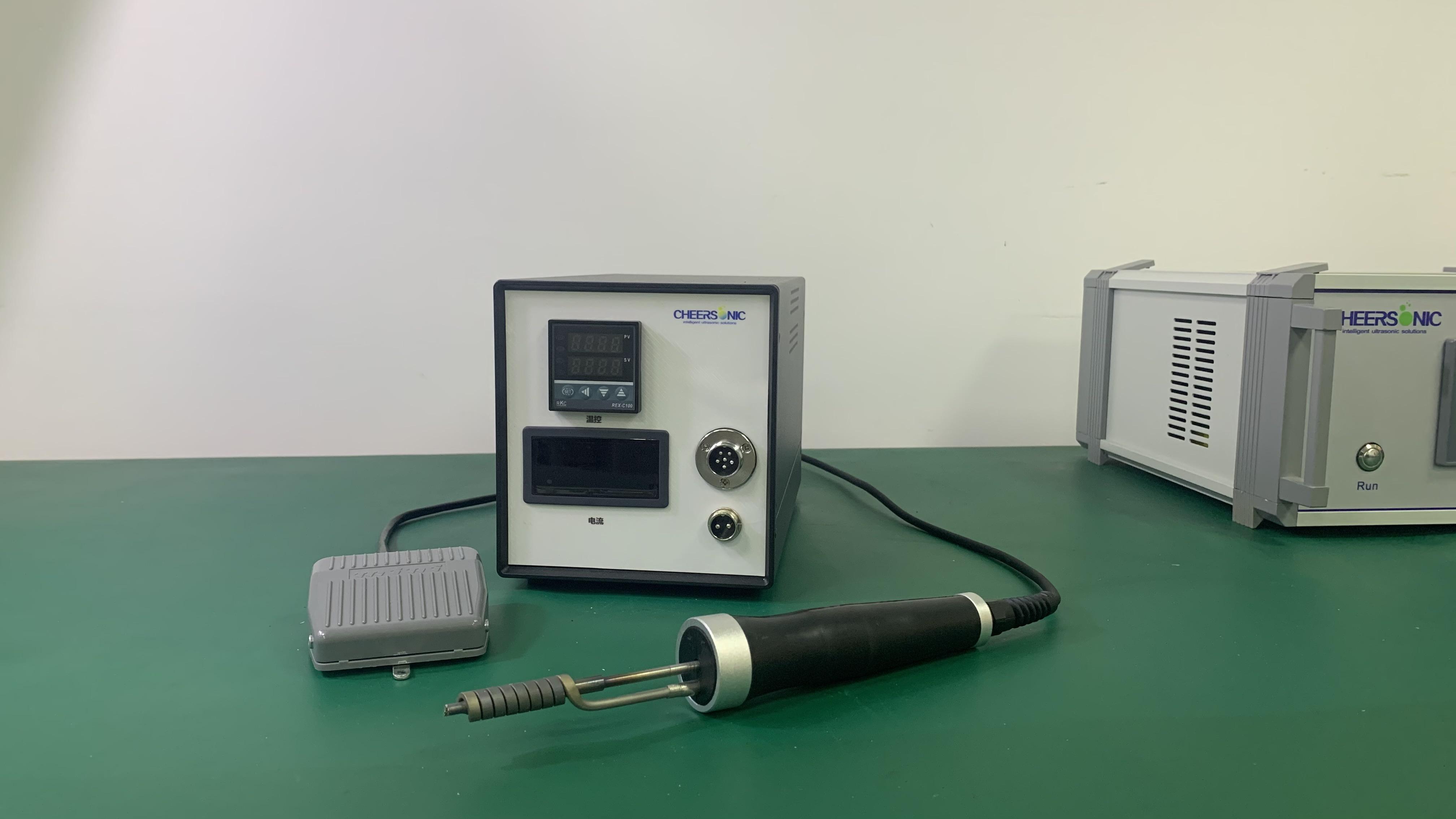 Ultrasonic fluxless soldering tool tip bonding a dissimilar-material joint