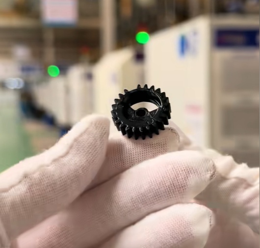 Injection molded components for automotive applications inspected at a manufacturing facility