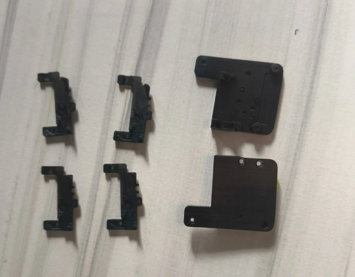 Prototype injection molded samples prepared for material, color and structure validation before mass production