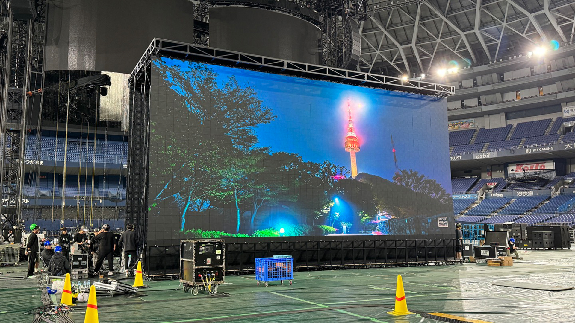 Large event stage using liftable foldable LED display systems in a roll-type deployment