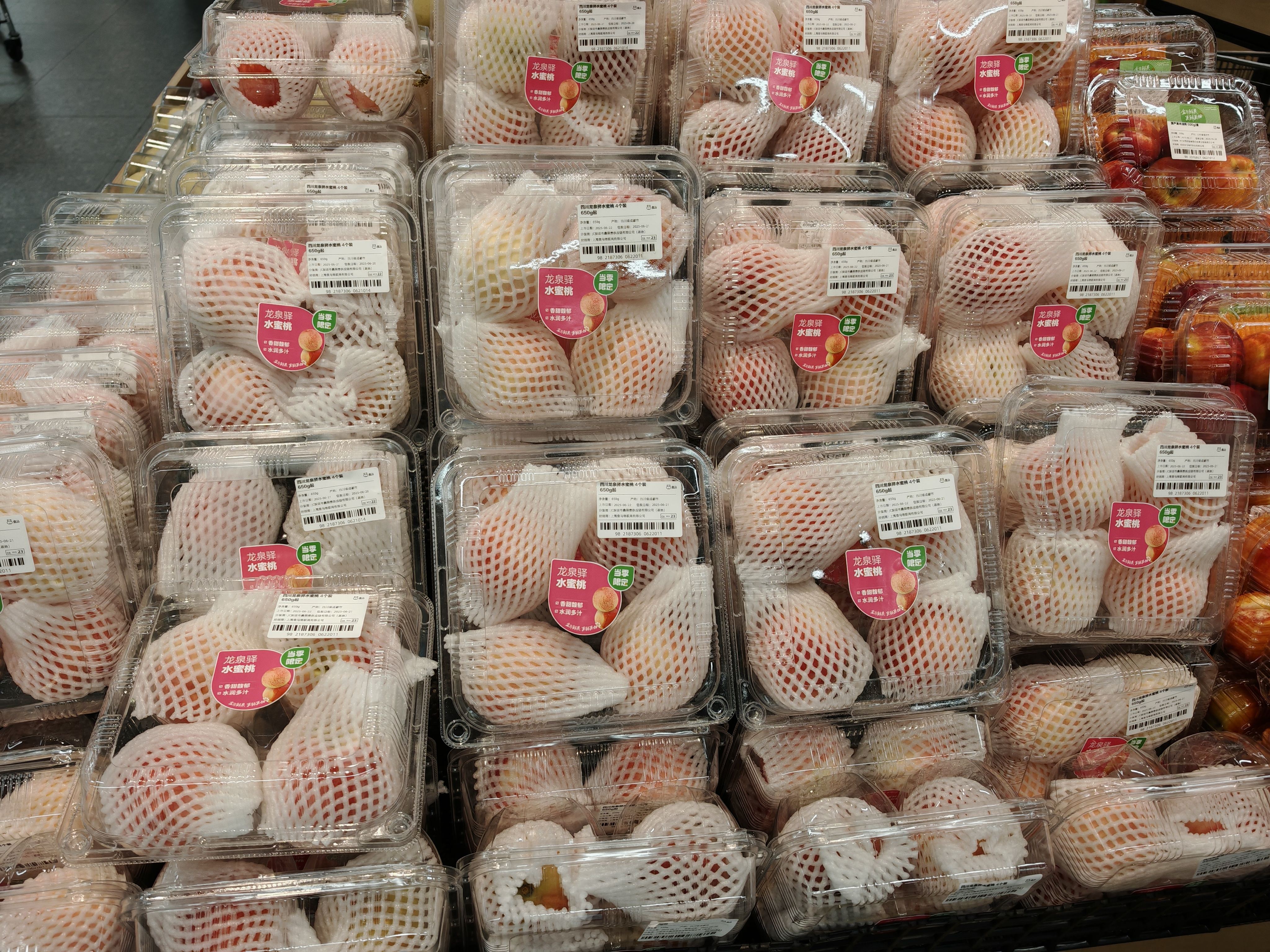 Fresh produce packaging containers in retail display