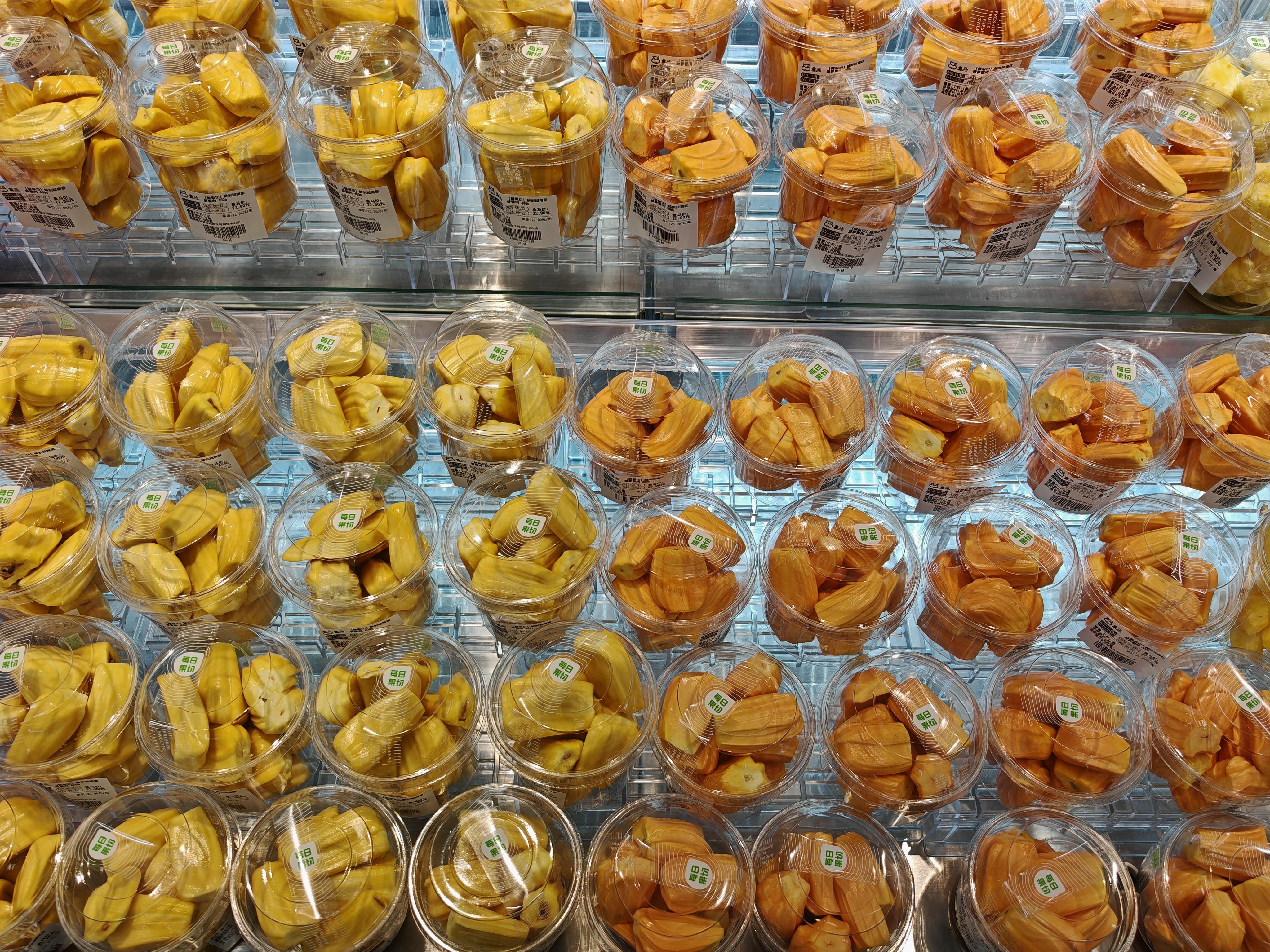 Clear bakery clamshell and tamper-evident containers in a retail food display