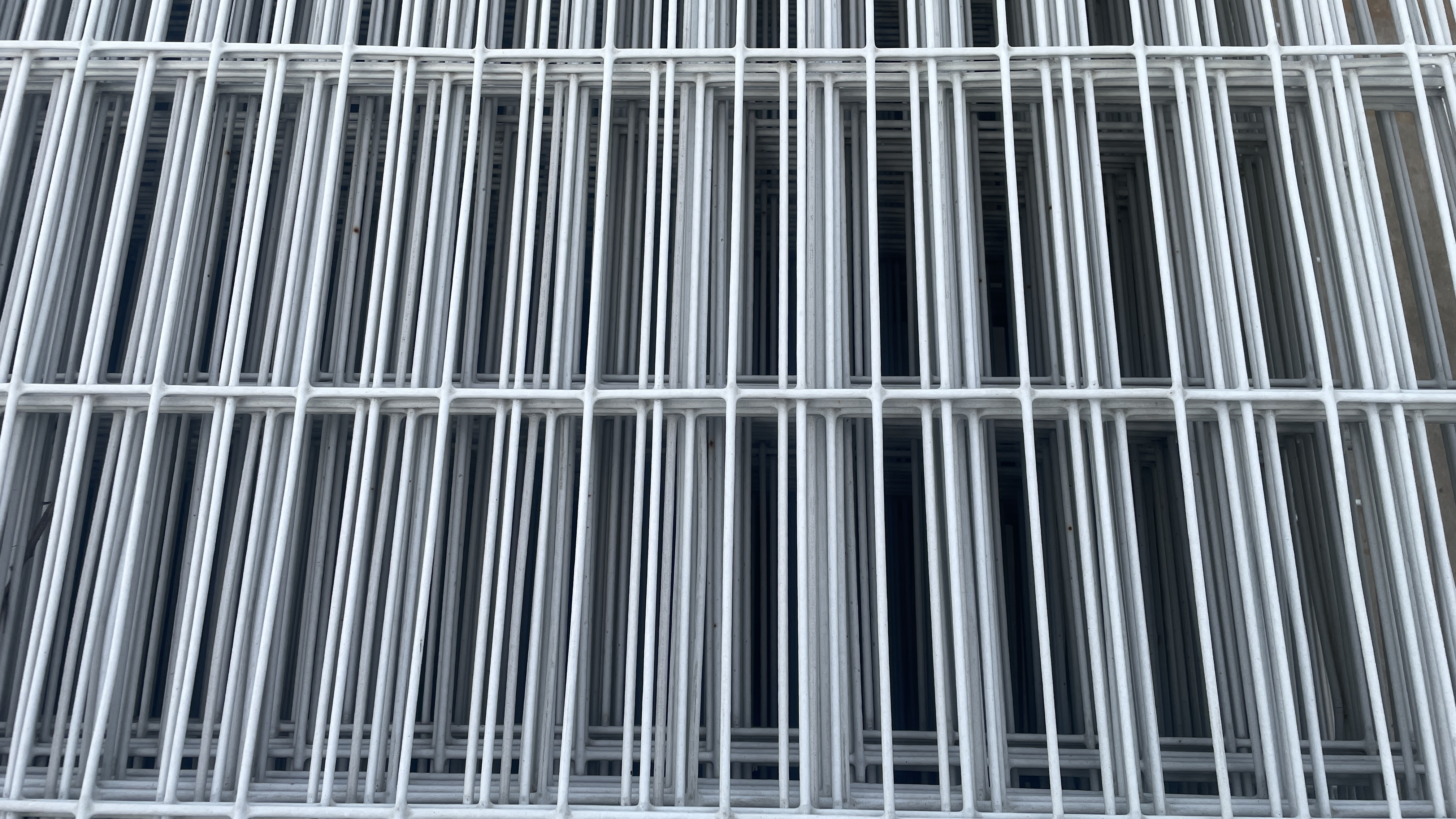 Galvanized chain link fence in a field