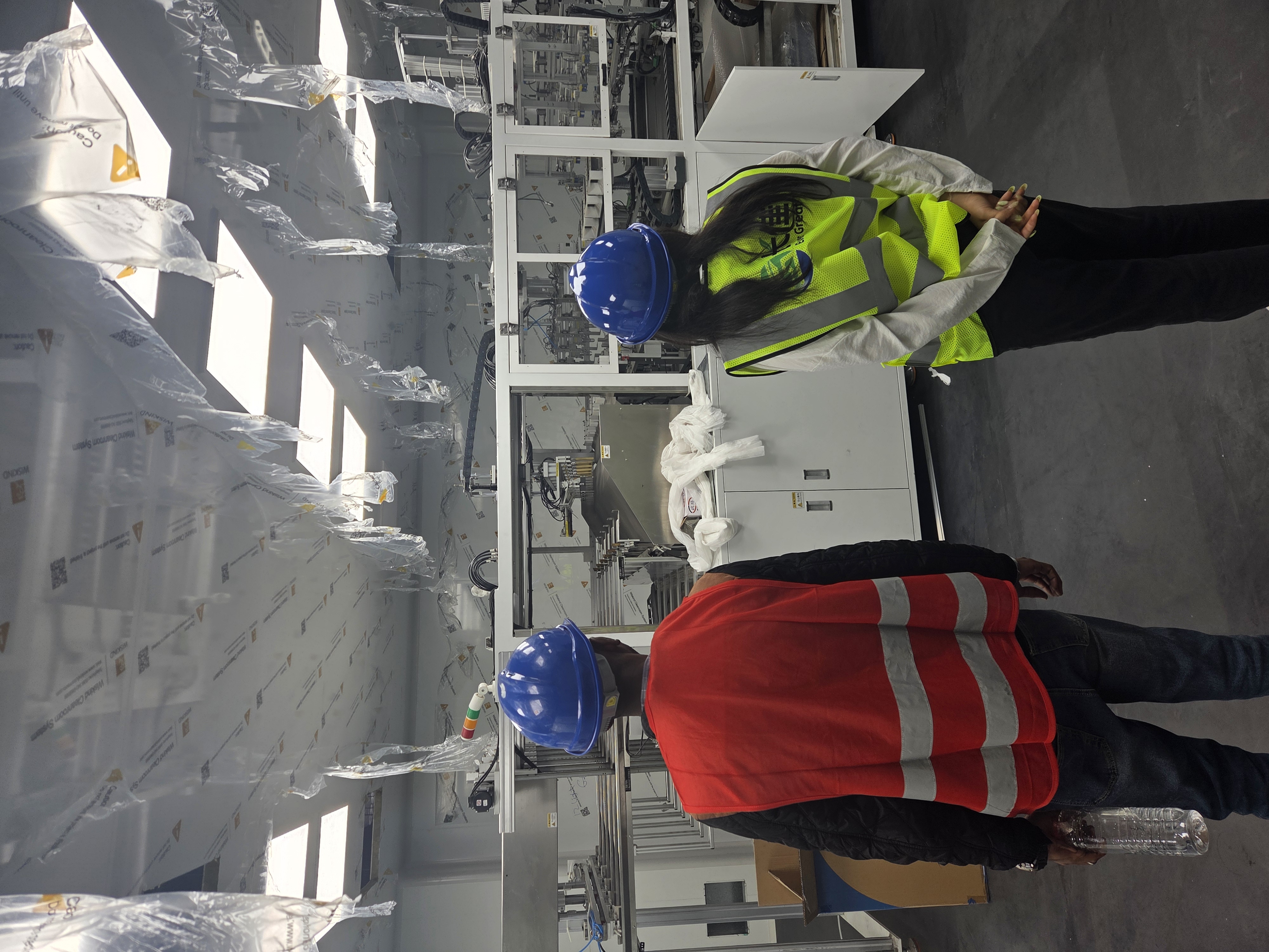 Installation team assembling laboratory base cabinets on site during a laboratory furniture project