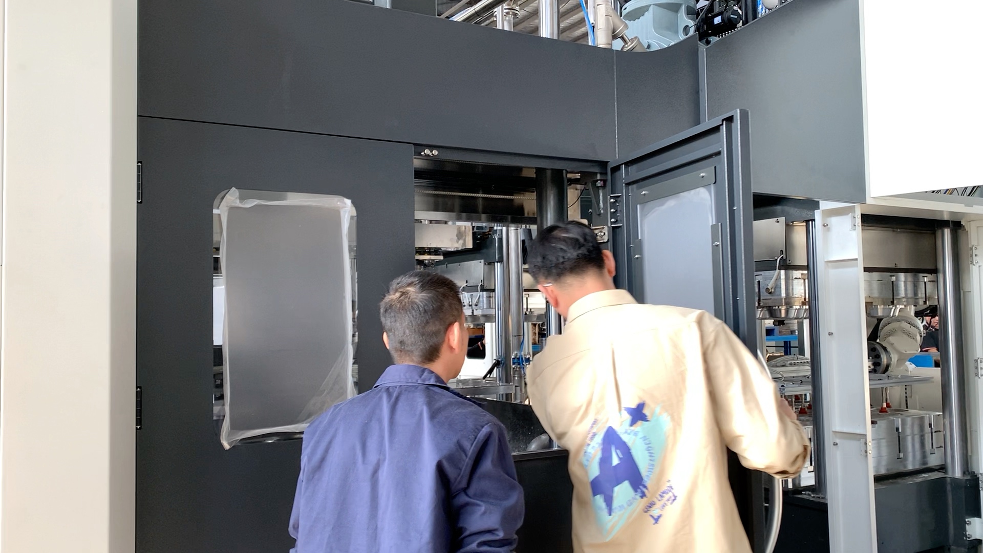 HANSON PULP MOLDING installation and commissioning engineers working on pulp molding equipment