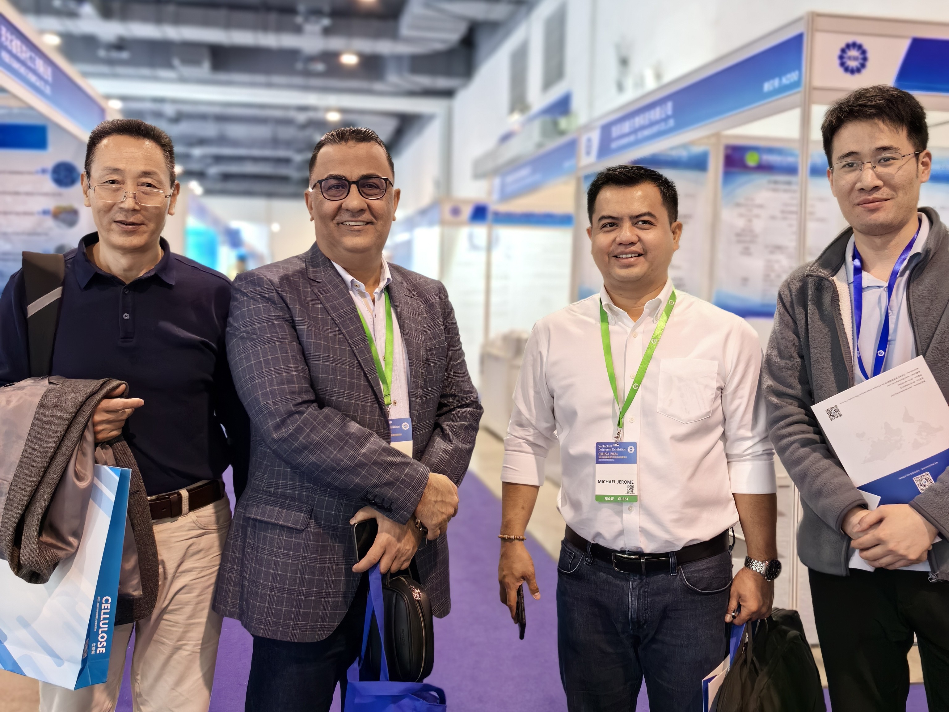 International chemical industry exhibition with technical buyers reviewing supplier materials