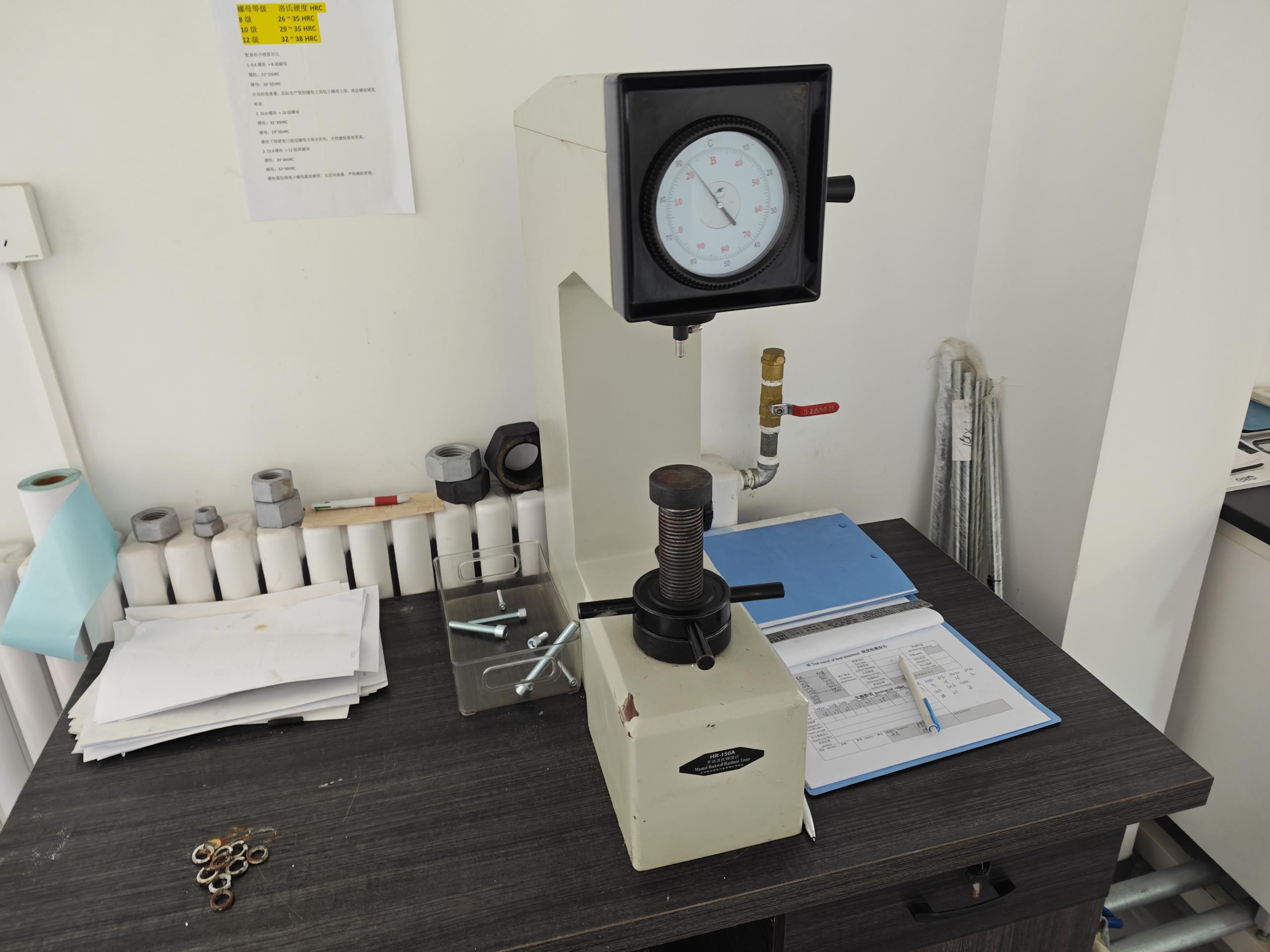 HR-150A Rockwell hardness tester used for in-house hardness verification of hex bolts