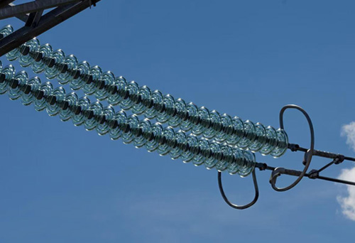 Suspension glass insulator string prepared for overhead transmission line installation