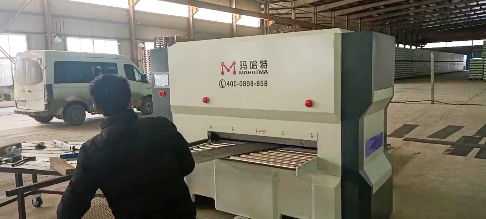 CNC leveling machine operating in a laser cutting shop