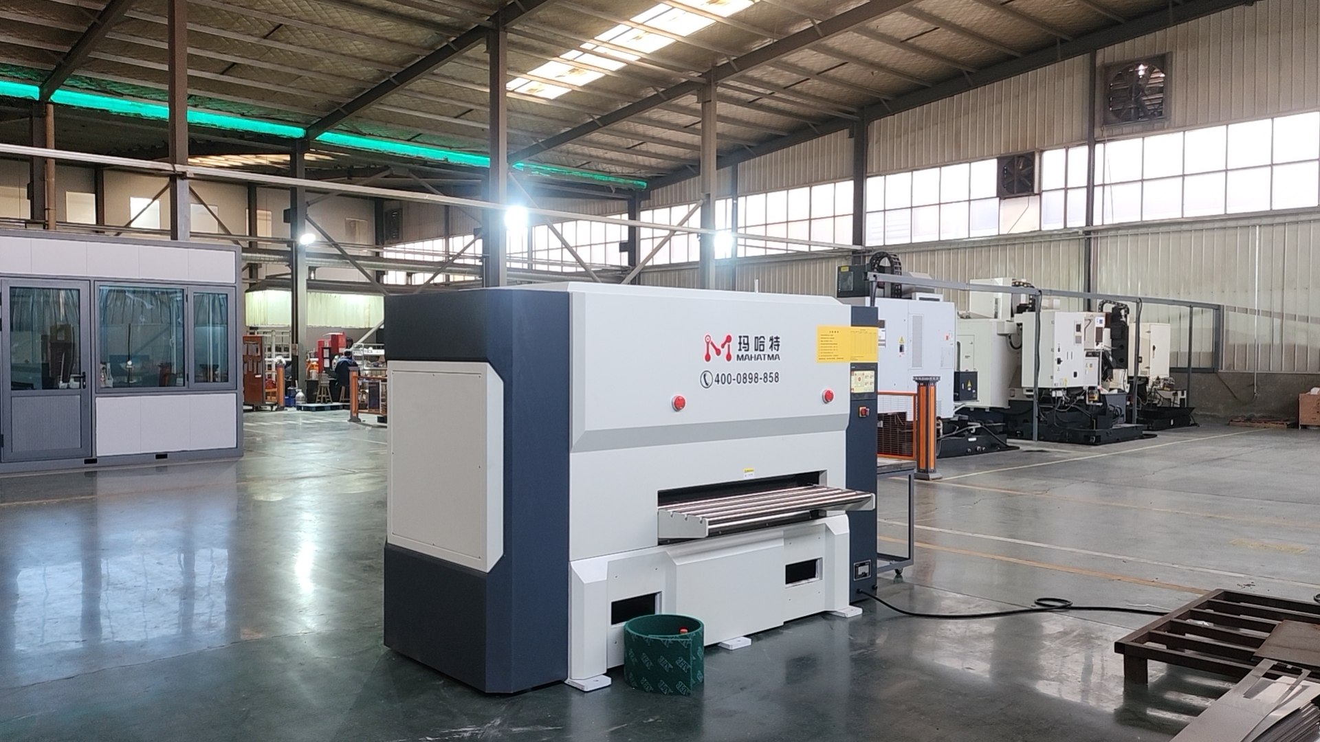 On-site operation of a MAHATMA CNC leveling machine at a customer facility