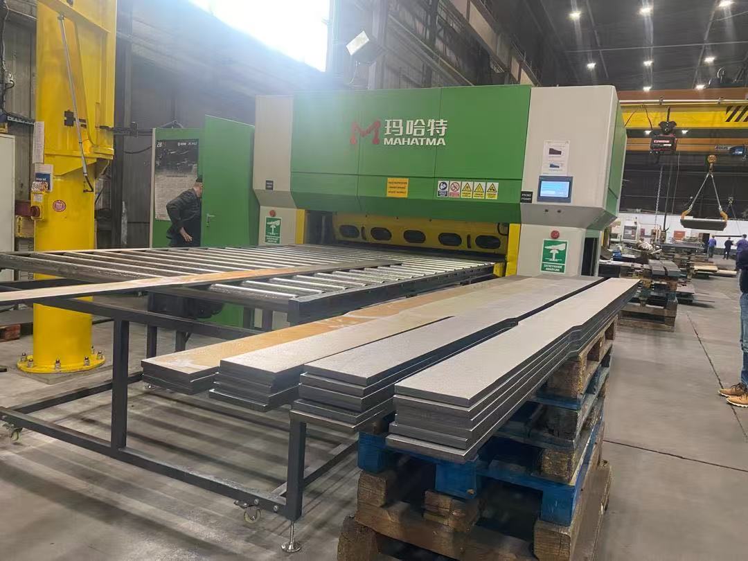 MHTR120 hydraulic leveler configured for leveling laser-cut parts in a sheet metal production line