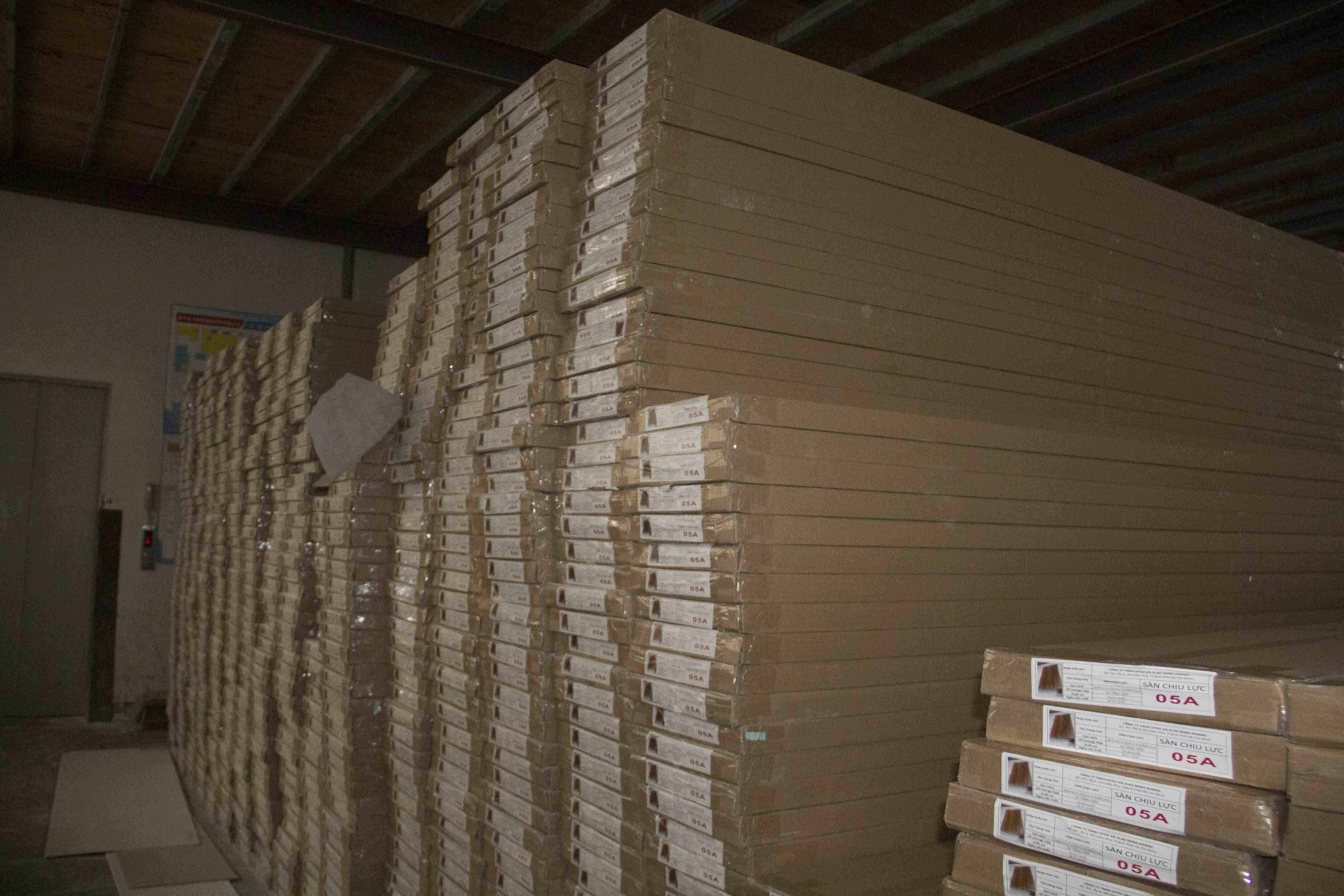Stocked PVC wall panels awaiting shipment at Haining Jianmu's warehouse