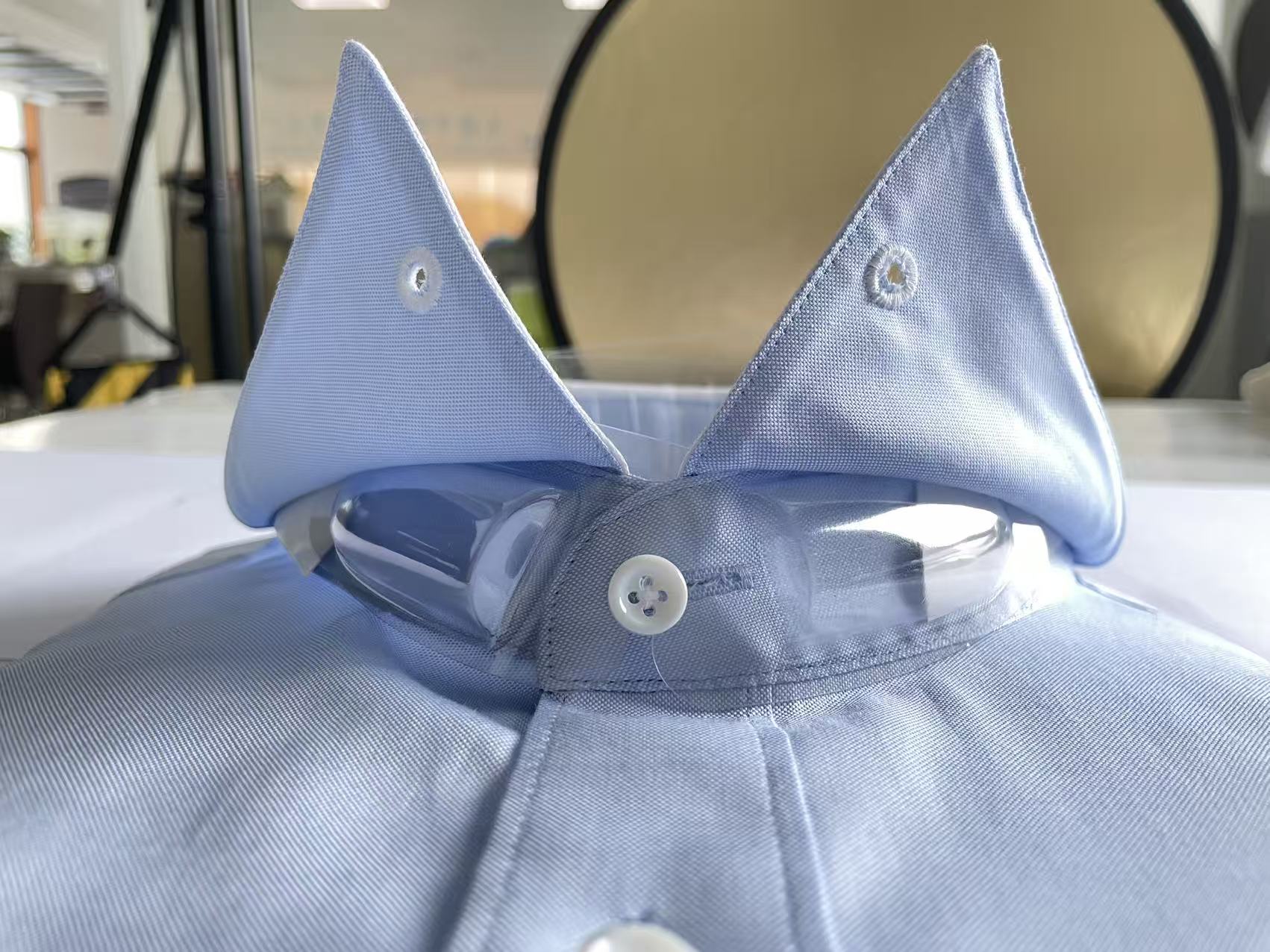 Shirt packaging accessories in a garment packing and finishing environment
