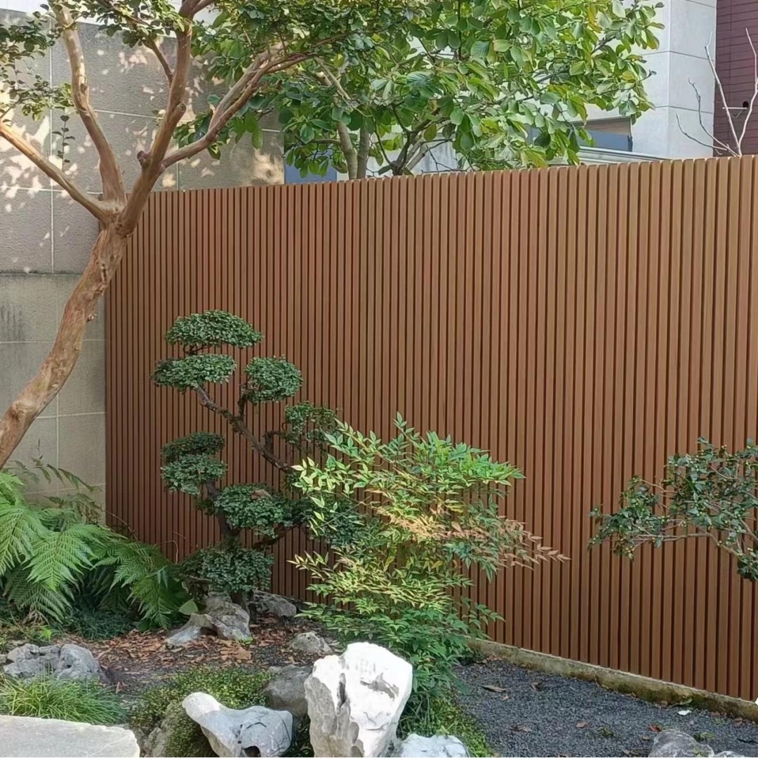 Outdoor WPC wall panel installation on a building facade