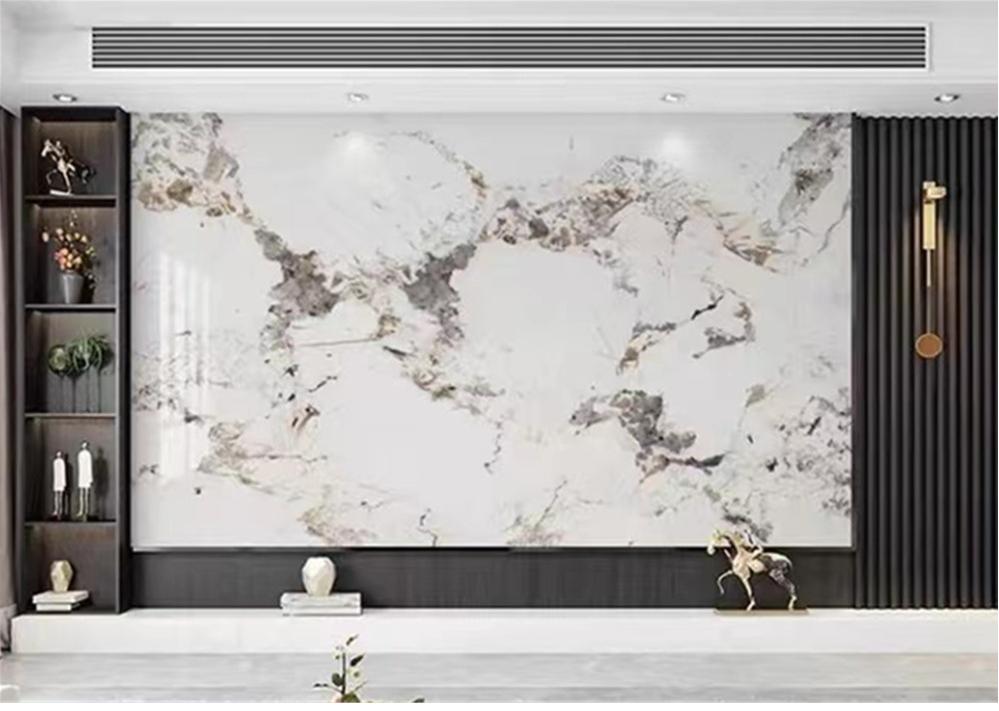 PVC marble sheet installation on an interior wall with adhesive fixing and joint alignment