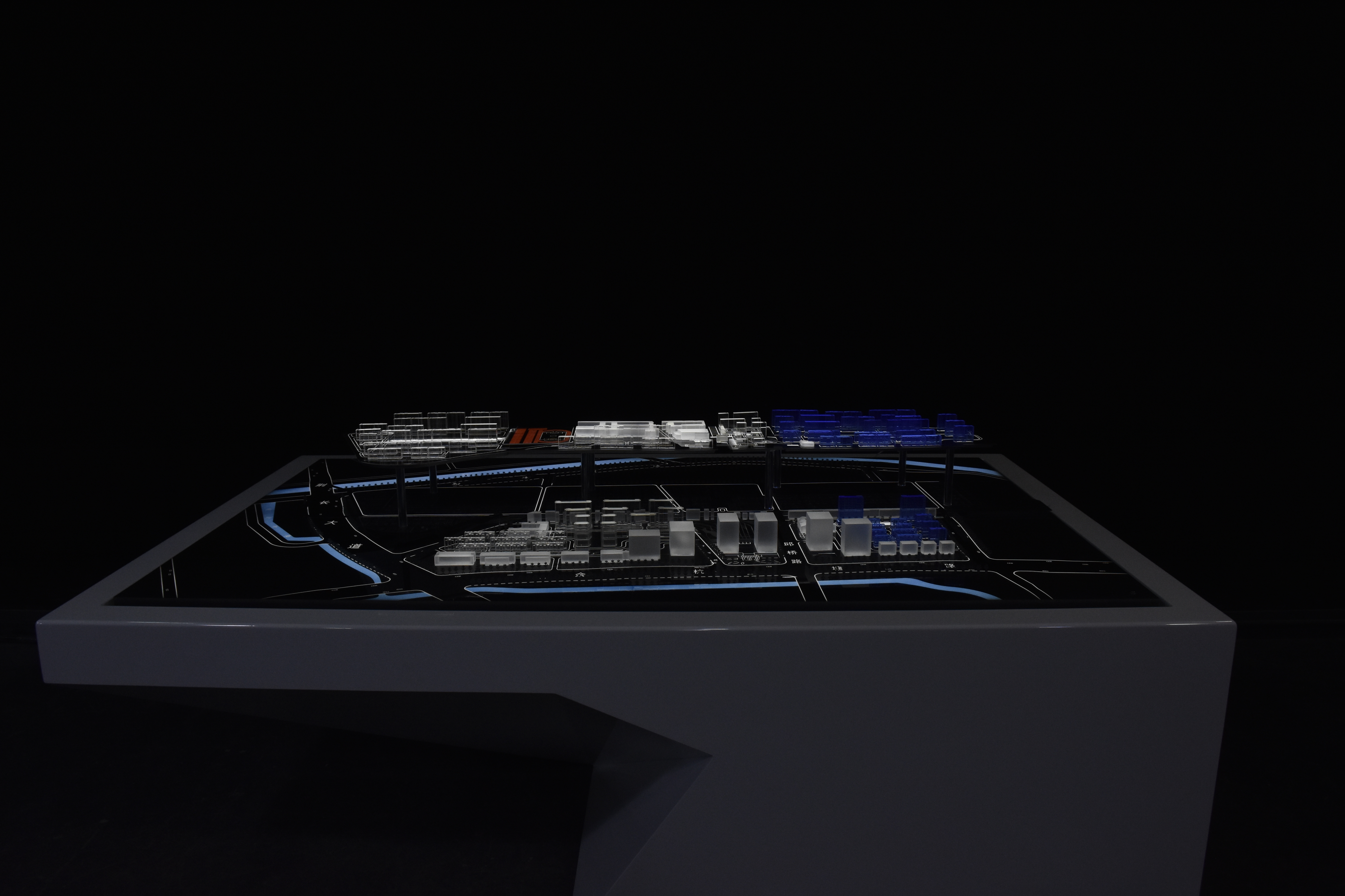 Master plan window display model built at 1:750 showing district layout, roads and landscaped context