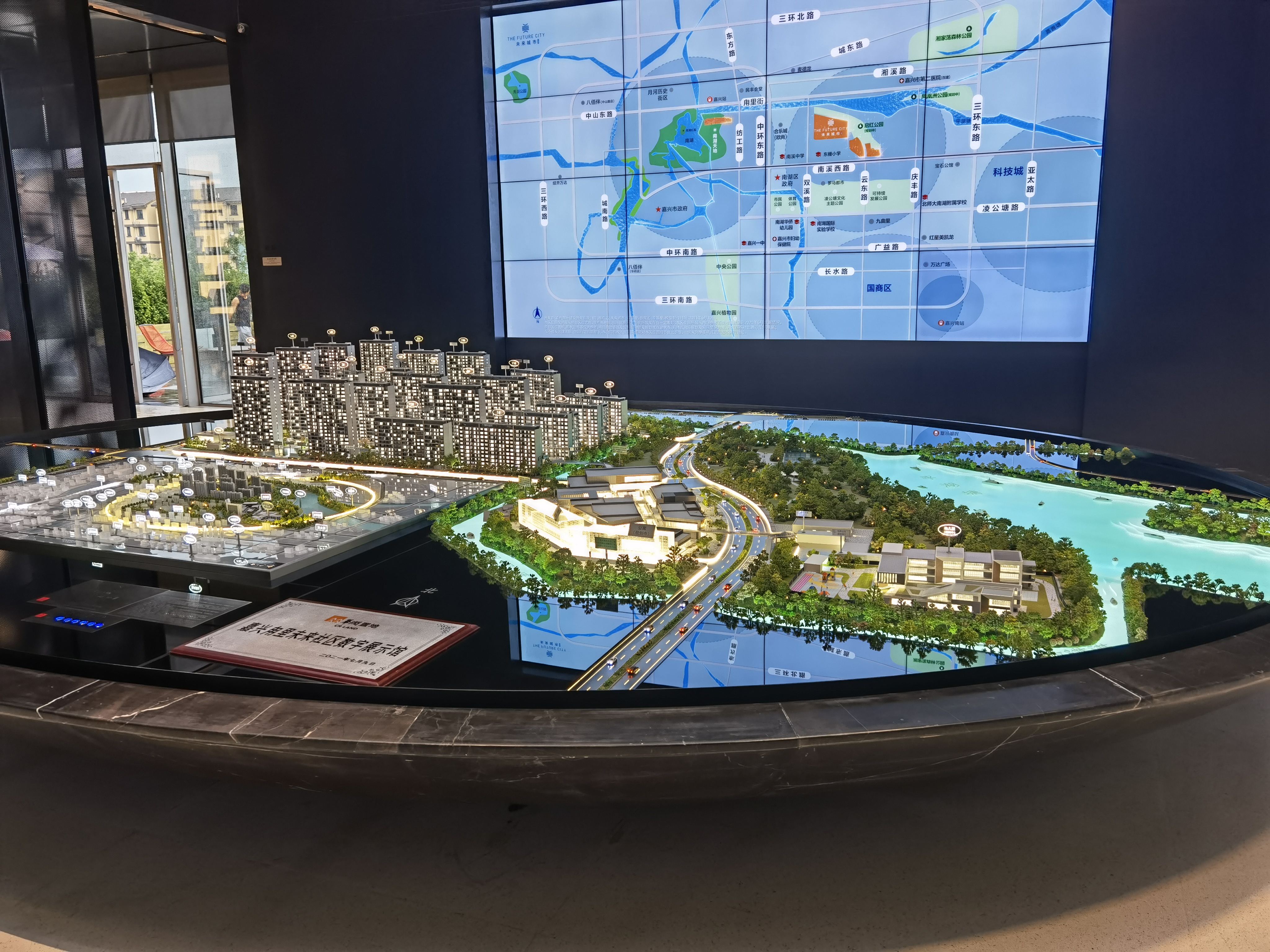 Master plan window display model with laser-cut road network, zoning plates and layered landscaping
