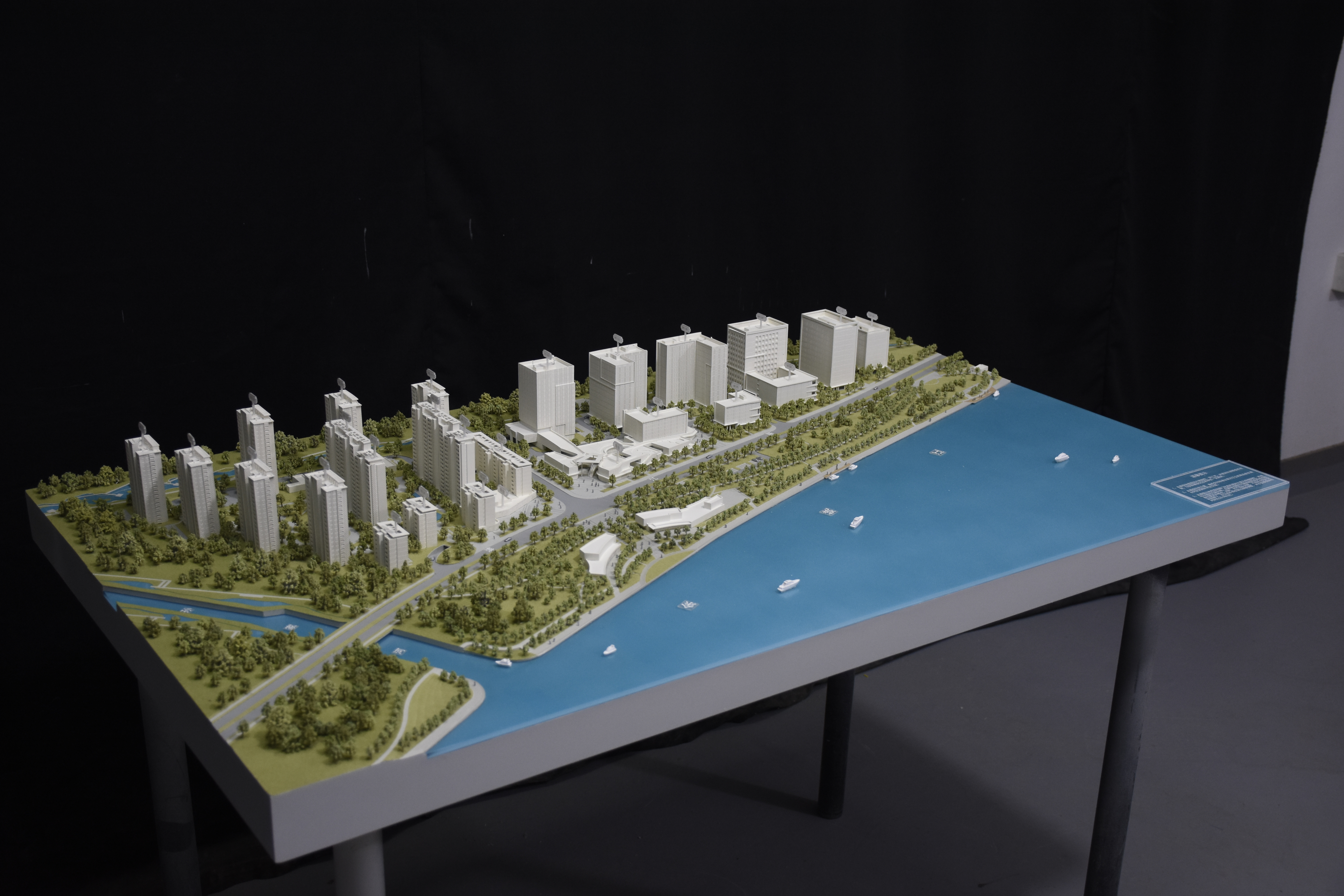 Master plan scale sand table model at 1:660 built for a touring exhibition, with terrain, roads and phased built areas