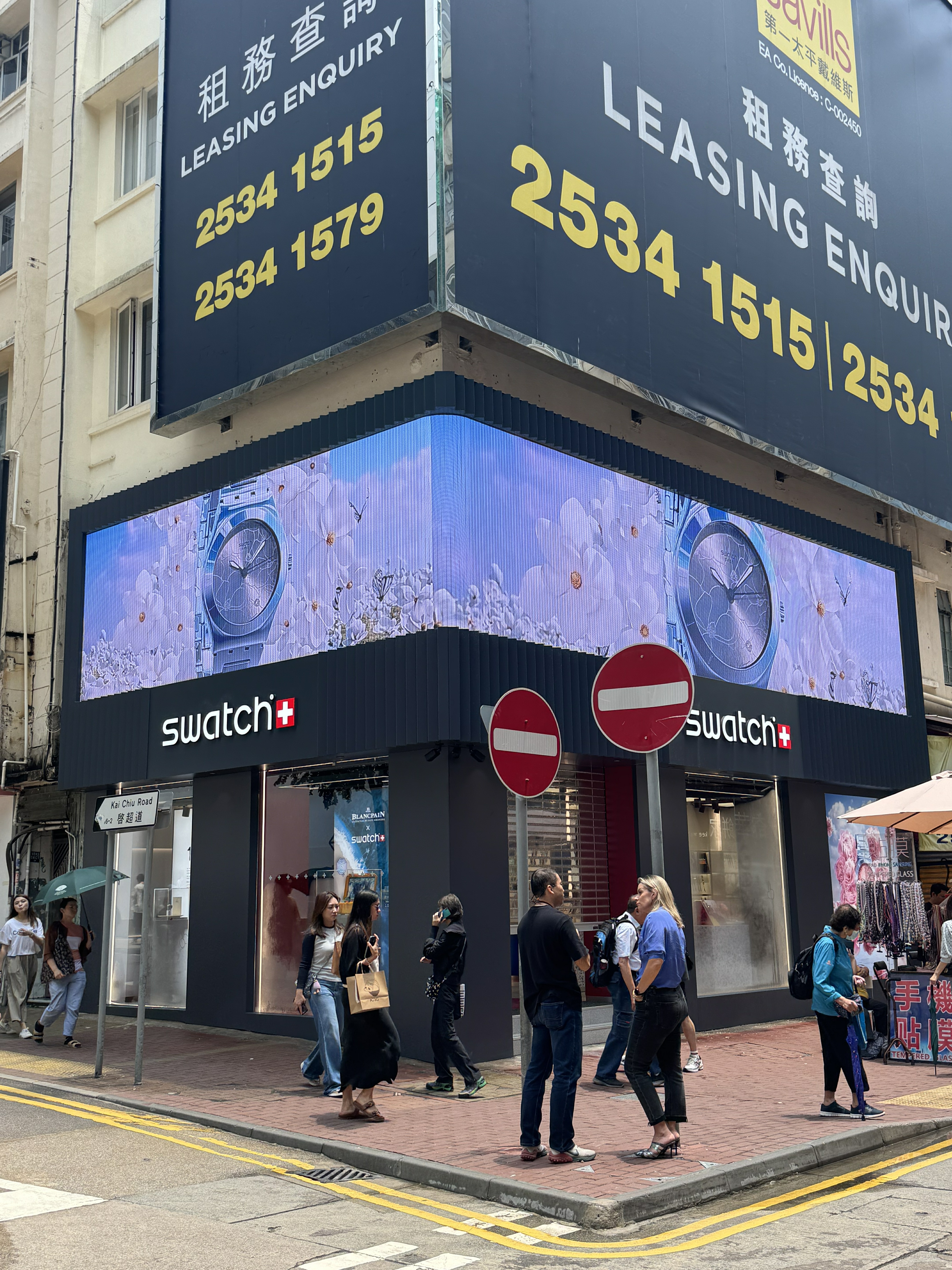 Large-format outdoor fixed LED billboard installed on a retail building facade