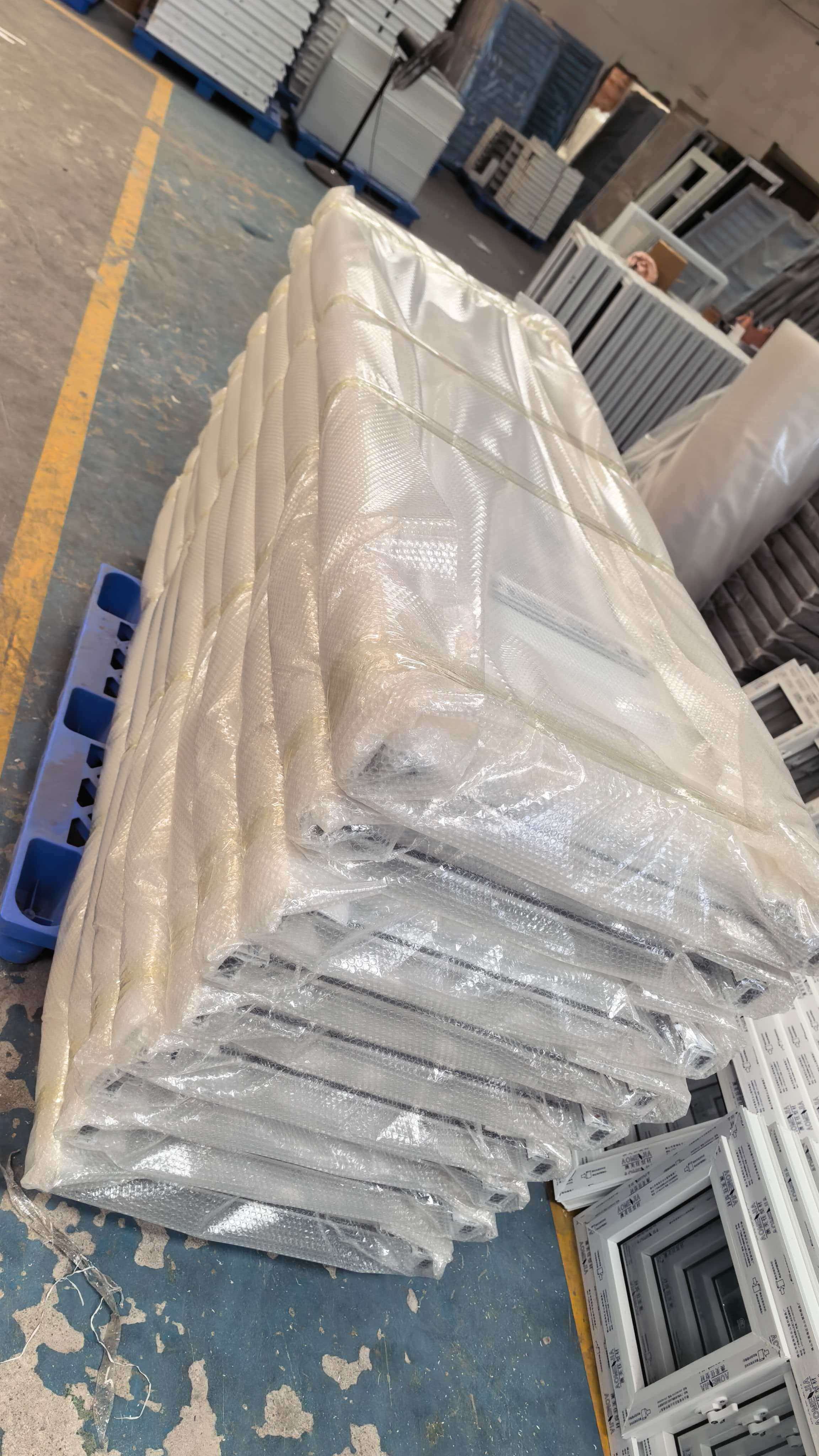 Fully packed UPVC door units prepared for shipment to a third-country project