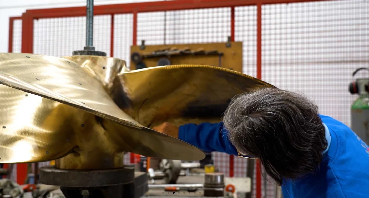 Propeller being checked and scanned on the repair table with a handheld metrology 3D scanner