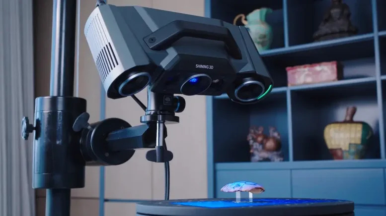 OptimScan Q12 high-precision 3D scanner capturing fine surface detail during a non-contact digitization project