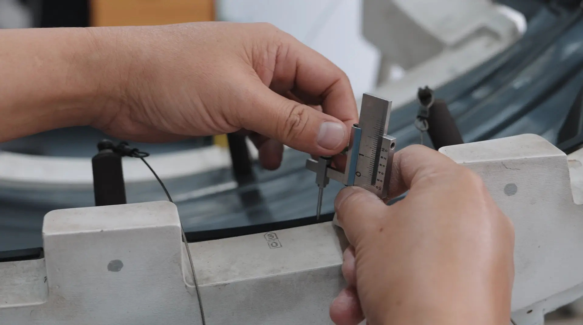 Manual caliper measurement of a basic dimension on a machined component