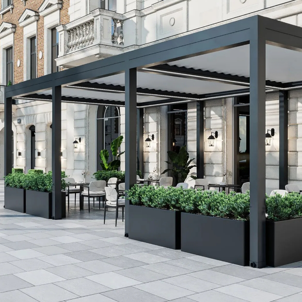 Commercial electric louvered pergola installation serving an outdoor hospitality area in Italy