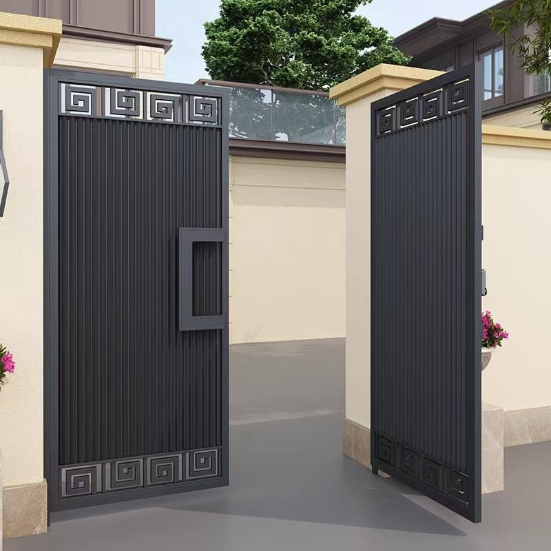 Hotel entrance area where automatic aluminum gates and matching fencing are specified